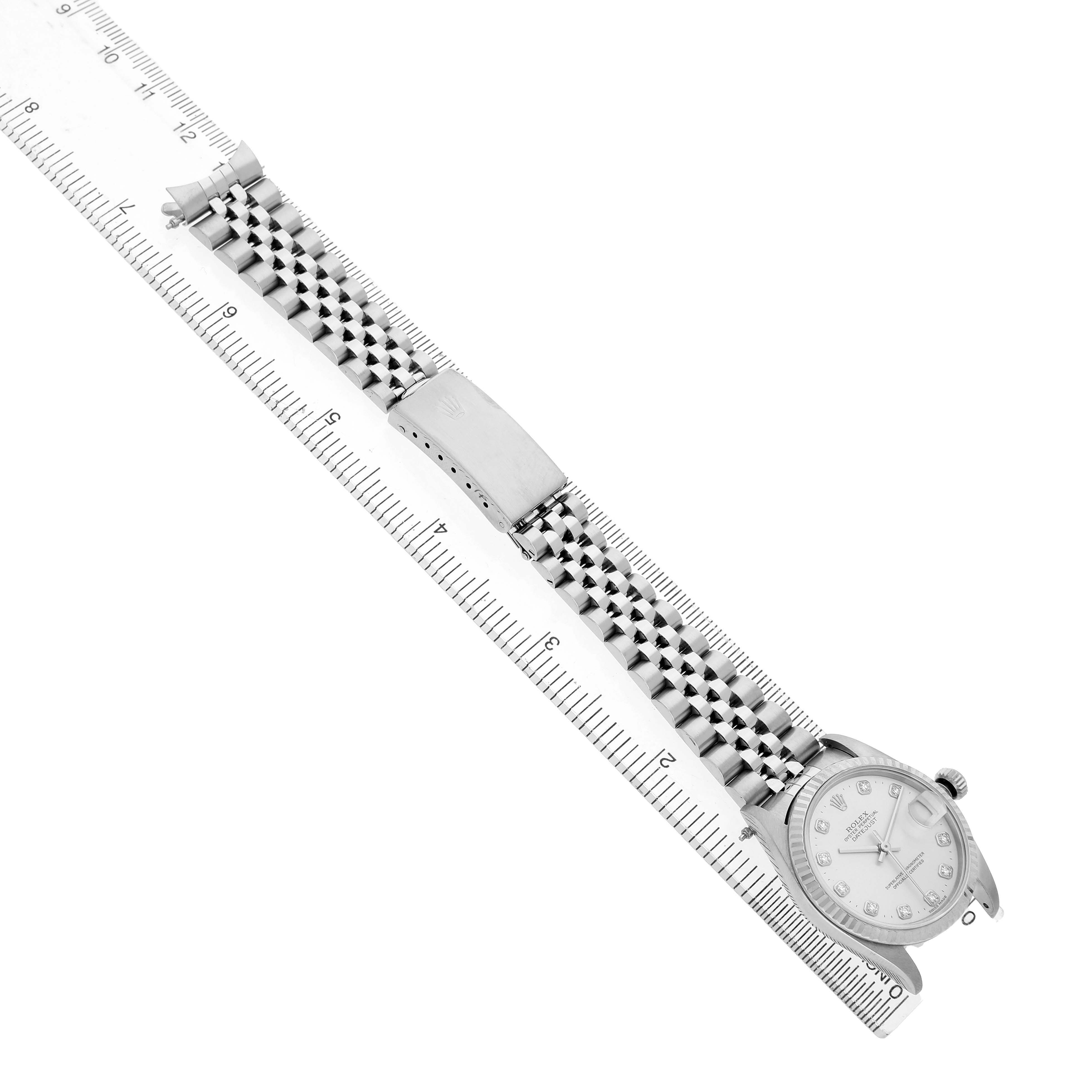 The Omega Seamaster 212.30.41.20.03.001 Men's Stainless Steel Blue Dial watch is shown from above, displaying the face, bracelet, and clasp alongside a ruler for size reference.