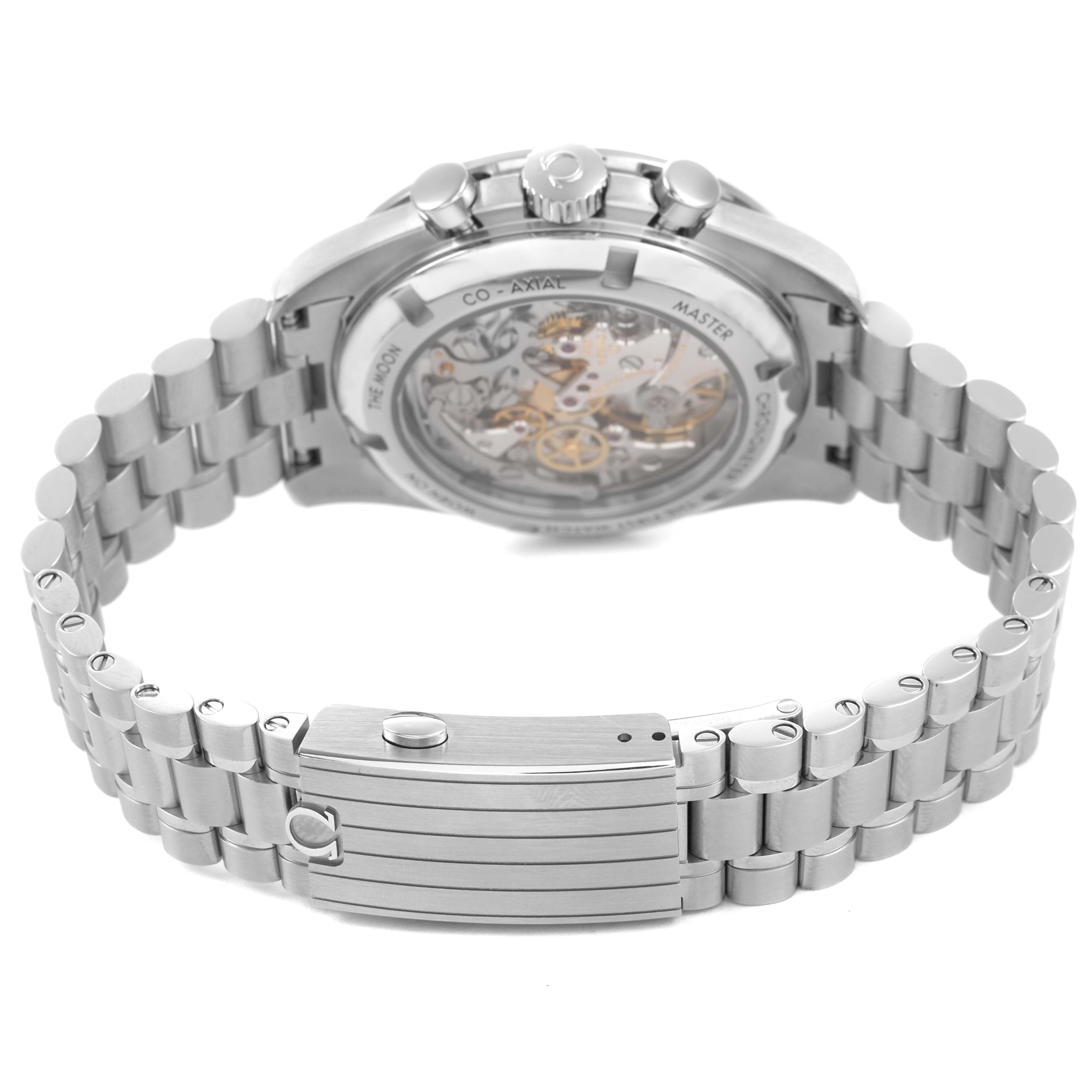 The image shows an Omega Speedmaster 310.32.42.50.01.002 Mens Stainless Steel Black Dial watch from the back, highlighting the transparent case back and metal bracelet.