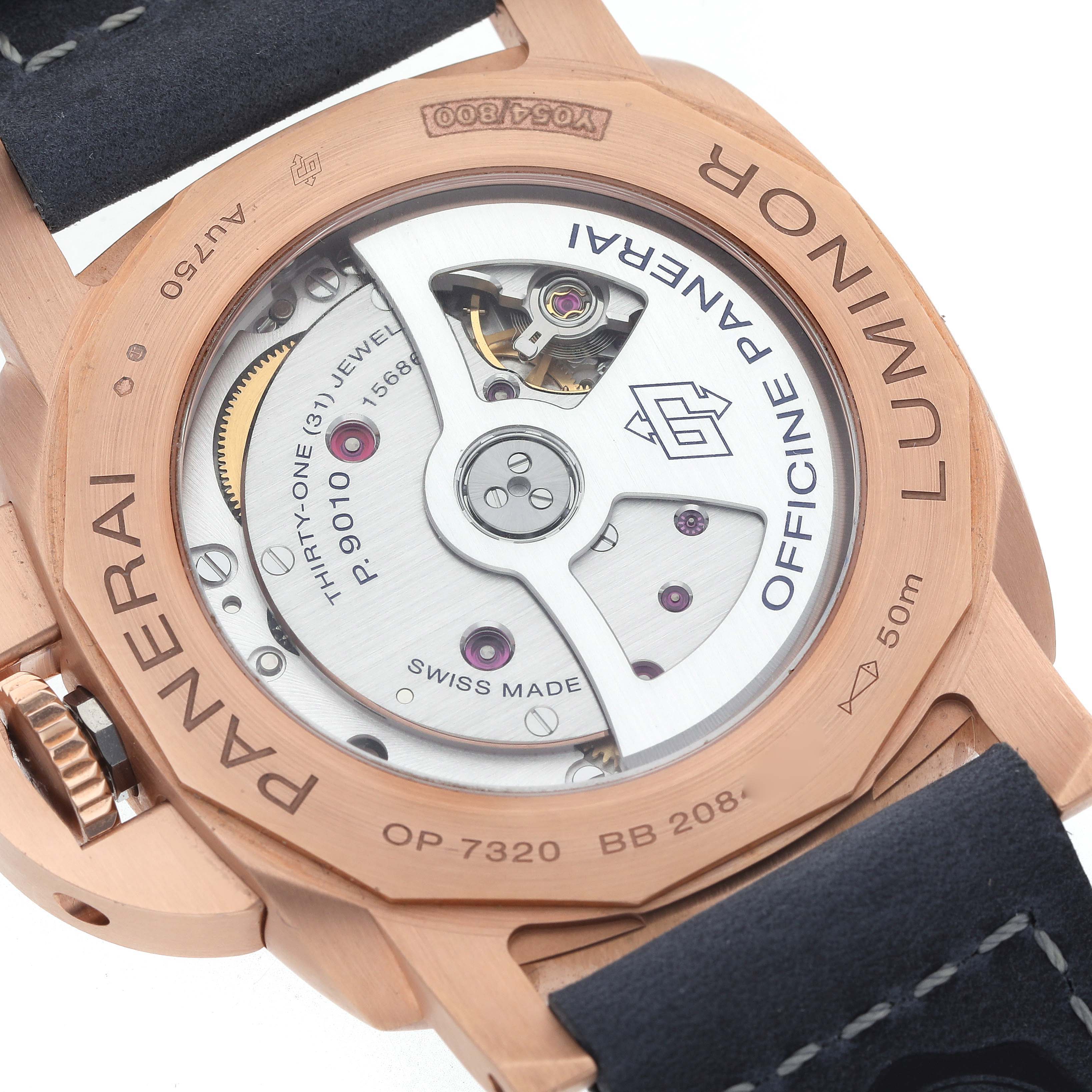 The image shows the back of a Panerai Luminor PAM01112 Men's Rose Gold Blue Dial watch, highlighting the movement and engravings.