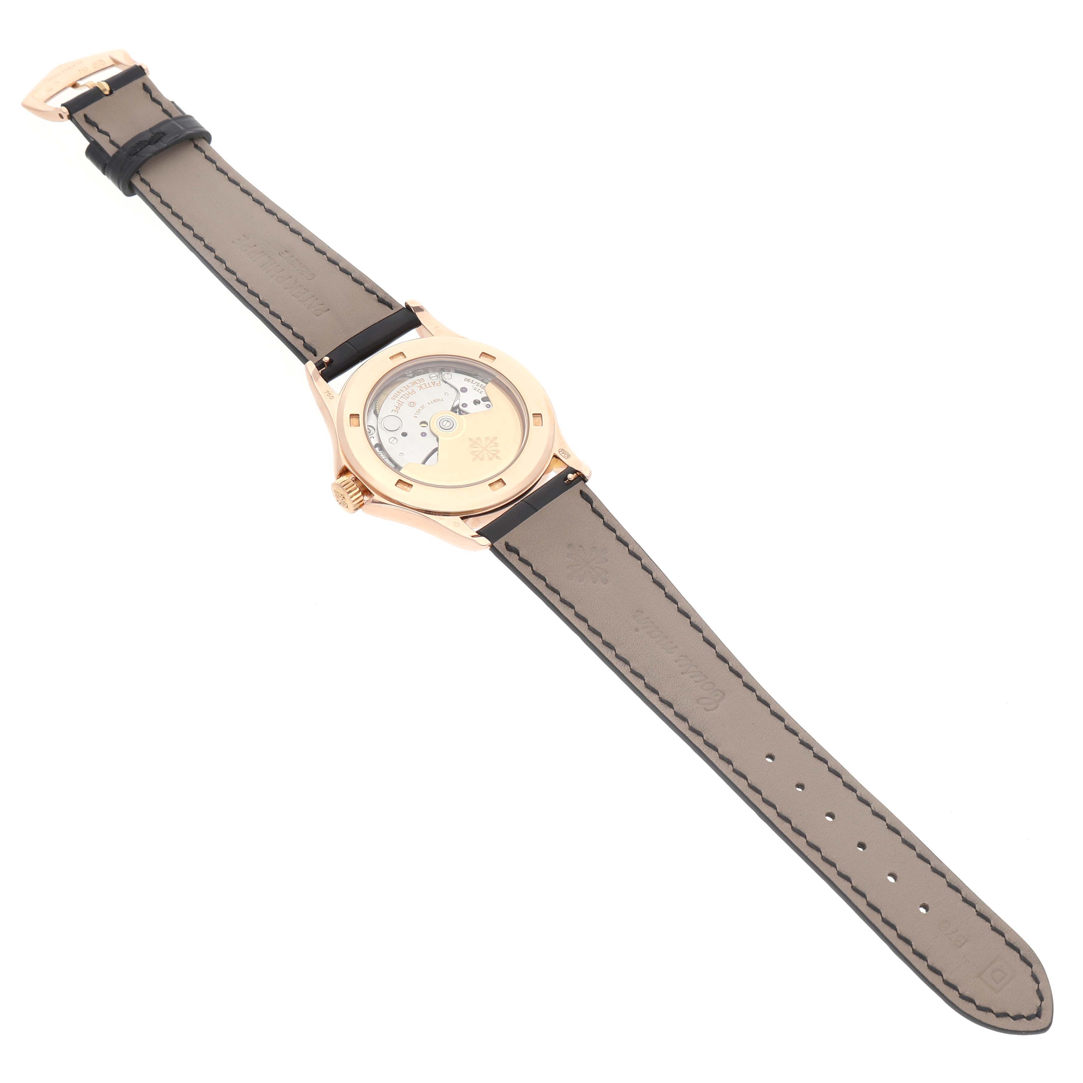 The image shows the back view of a Patek Philippe Calatrava 5117R-001 Mens Rose Gold White Dial watch, highlighting the movement and leather strap.