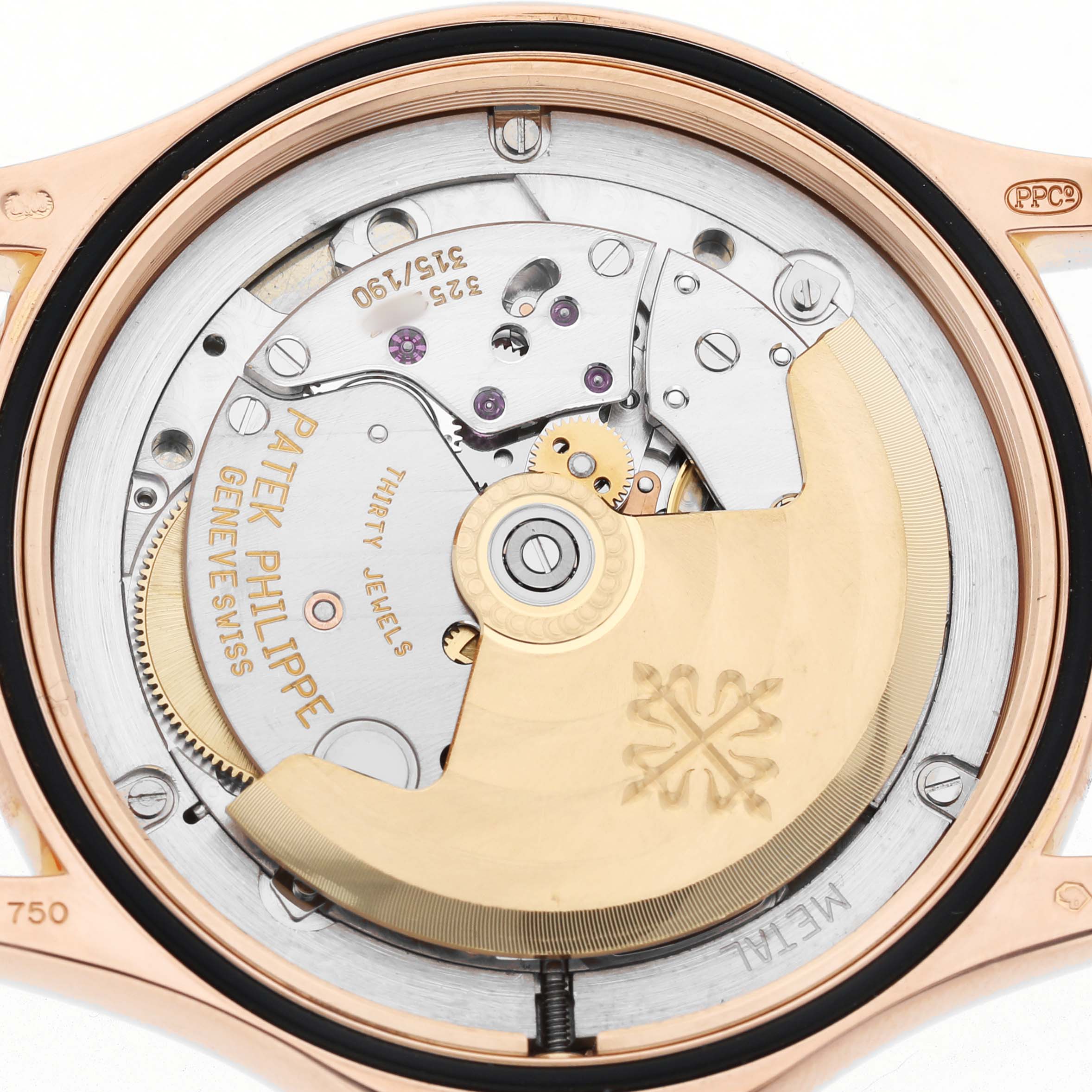 The image shows the back of the Patek Philippe Calatrava 5117R-001 Mens Rose Gold White Dial watch, highlighting its mechanical movement and rotor.