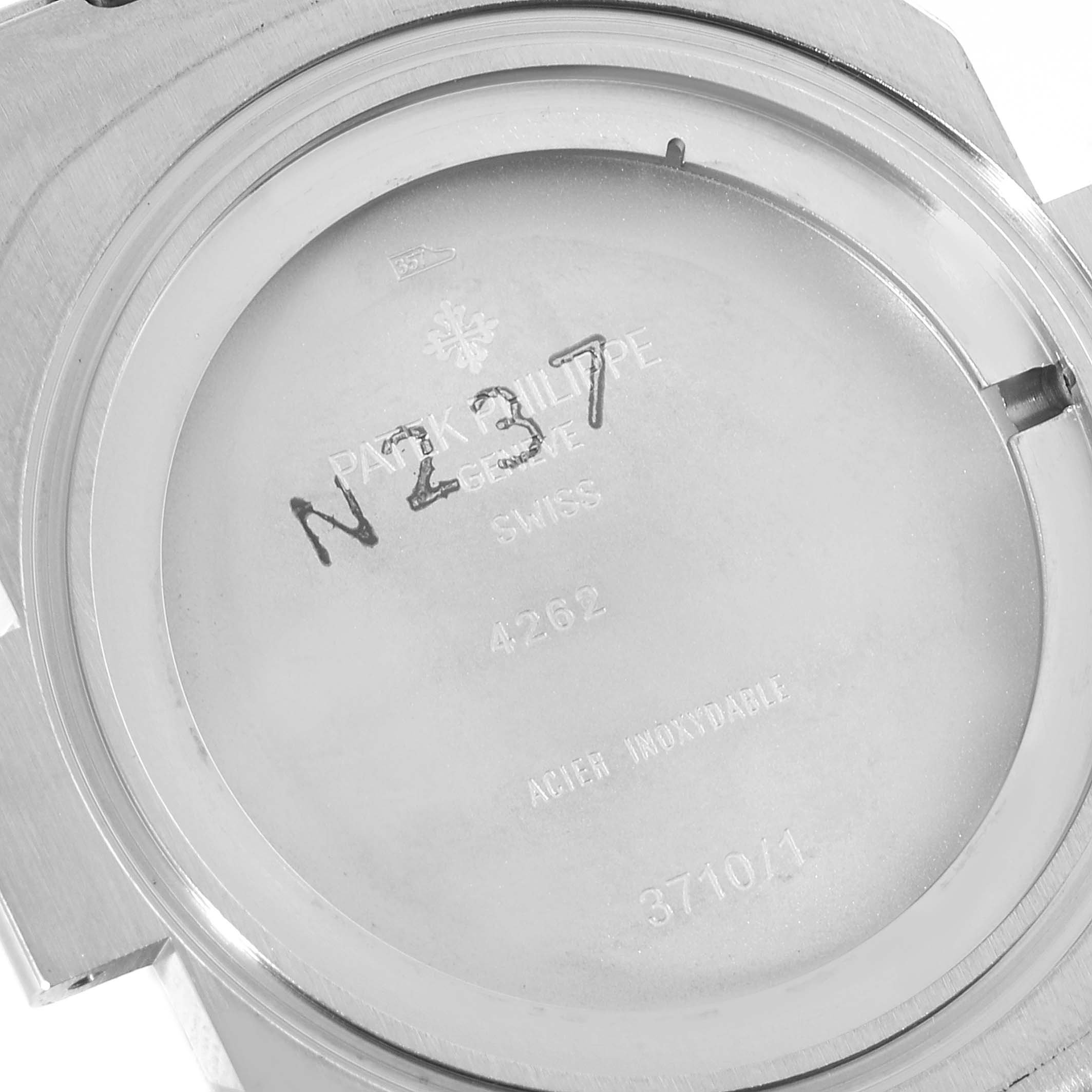 This image shows the case back of a Patek Philippe Nautilus 3710/1A Men's Stainless Steel Black Dial 3710/1A Men's Stainless Steel Black Dial watch, displaying model and serial information.