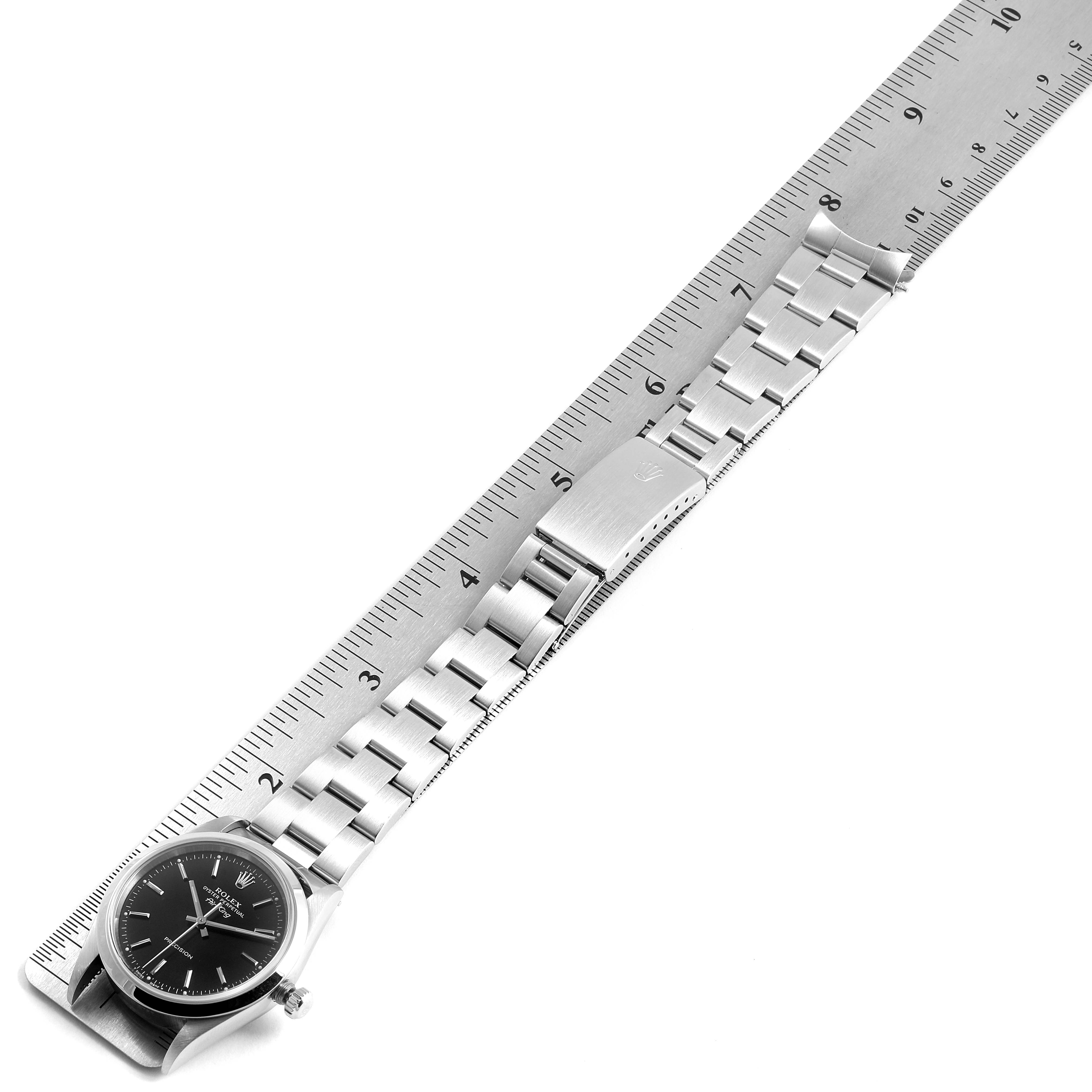 The image shows a Rolex Air-King 14000 Men's Stainless Steel Black Dial 14000 Men's Stainless Steel Black Dial watch laid flat alongside a ruler, displaying its face, bracelet, and clasp.