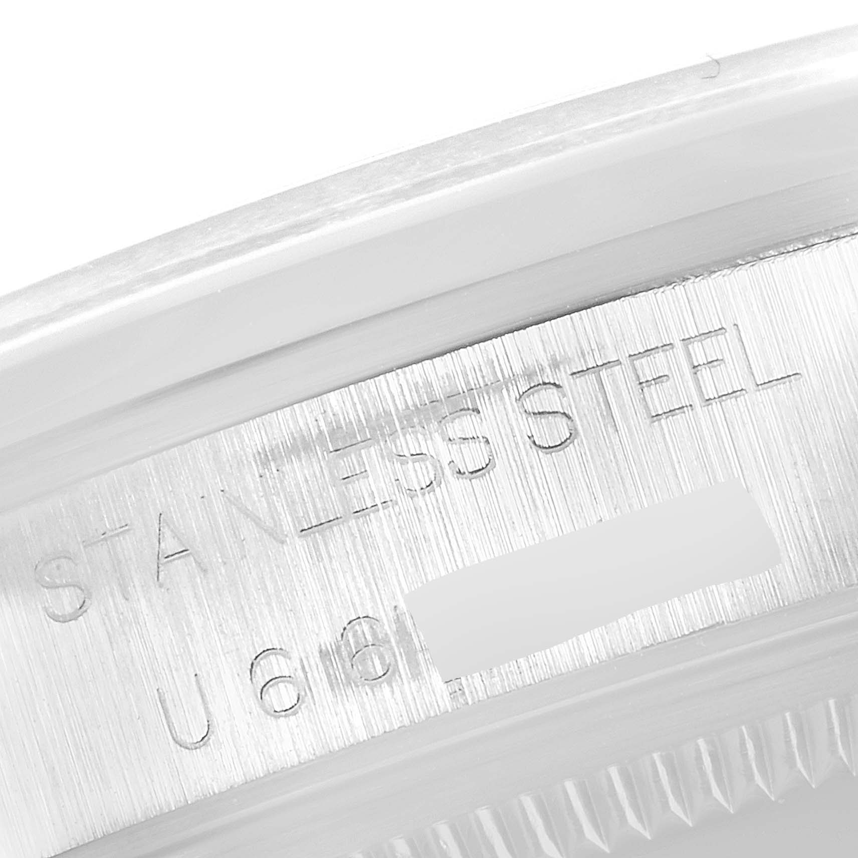 The image shows a close-up view of the case edge of a Rolex Air-King 14000 Men's Stainless Steel Black Dial 14000 Men's Stainless Steel Black Dial watch, highlighting its stainless steel marking and partial serial number.