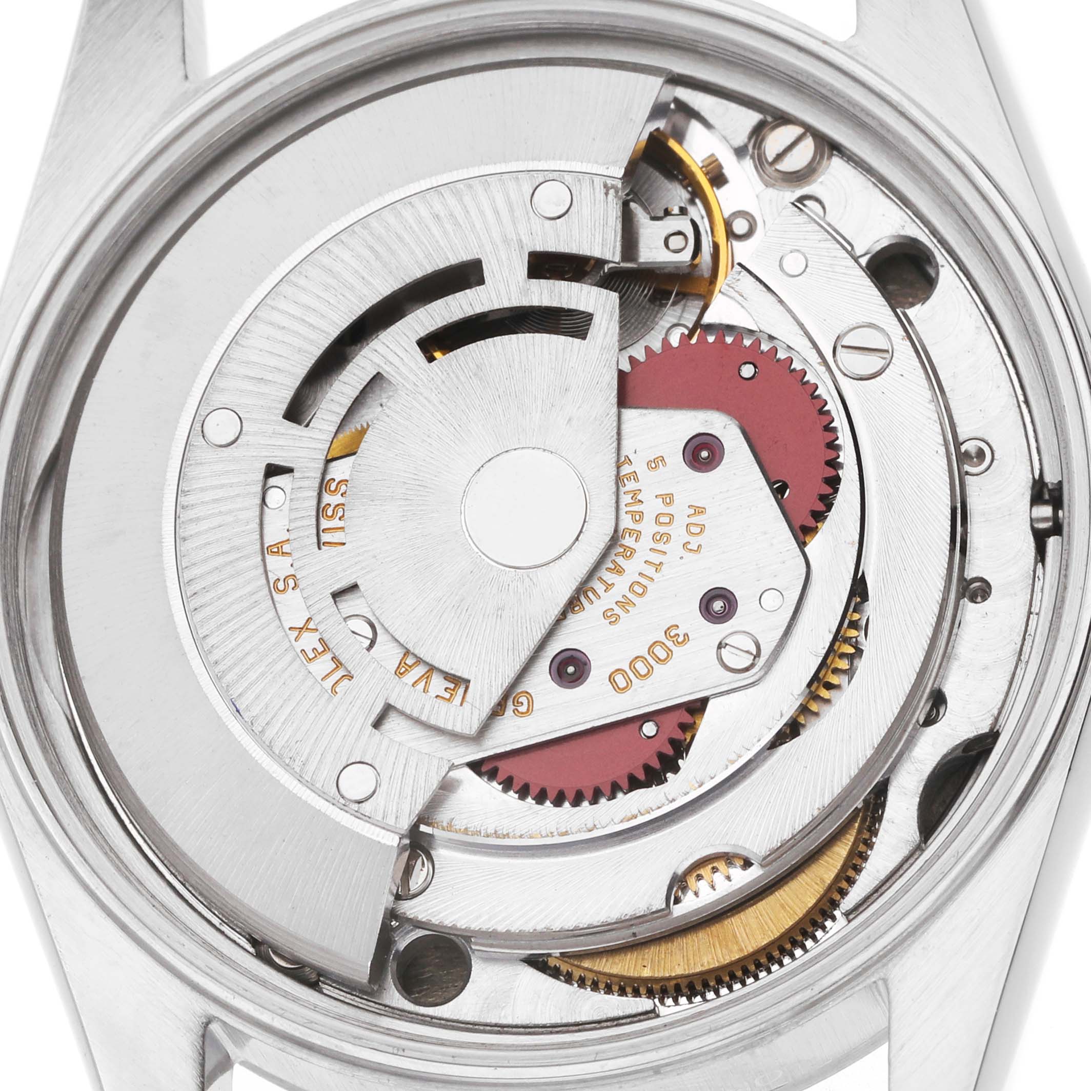 The image shows a Rolex Air-King 14000 Men's Stainless Steel Black Dial watch movement from a top angle, highlighting gears and the rotor.