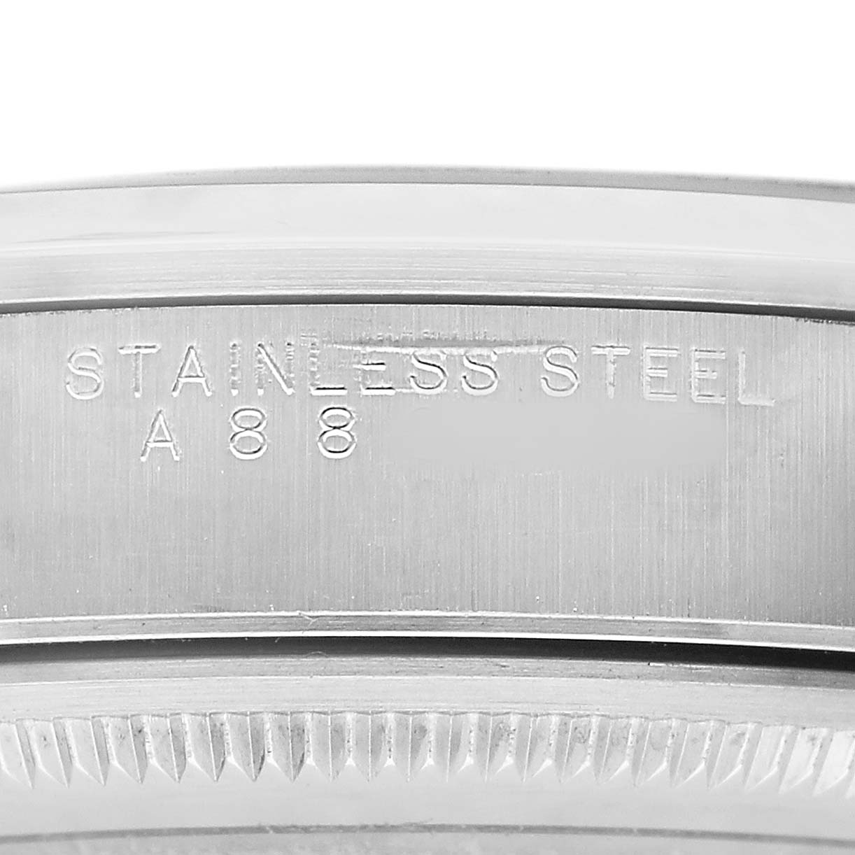 The image shows the side of a Rolex Air-King 14000 Mens Stainless Steel Pink Dial watch case with "STAINLESS STEEL" and "A88" engraved on it.