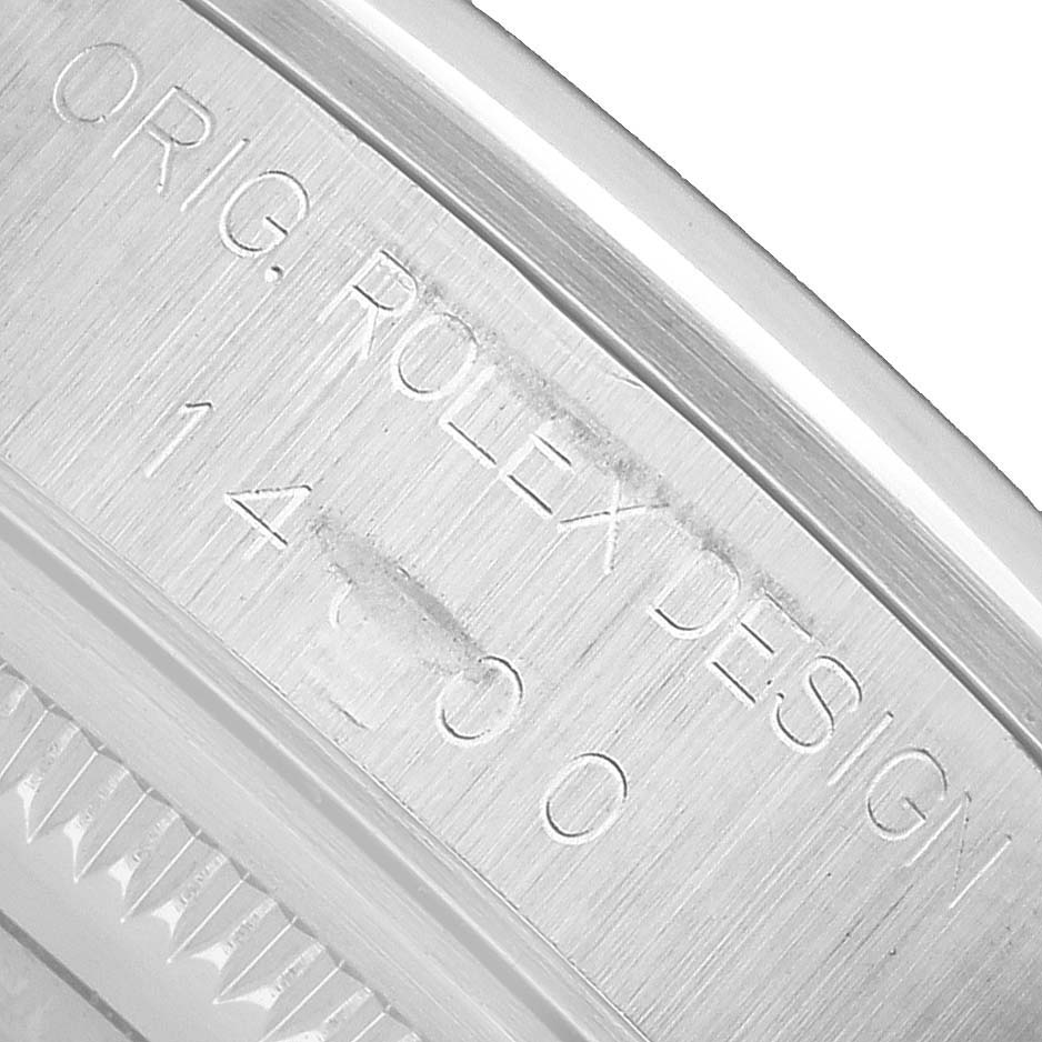 The image shows a close-up of the inner bezel of a Rolex Air-King 14000 Mens Stainless Steel Pink Dial, highlighting the engravings.