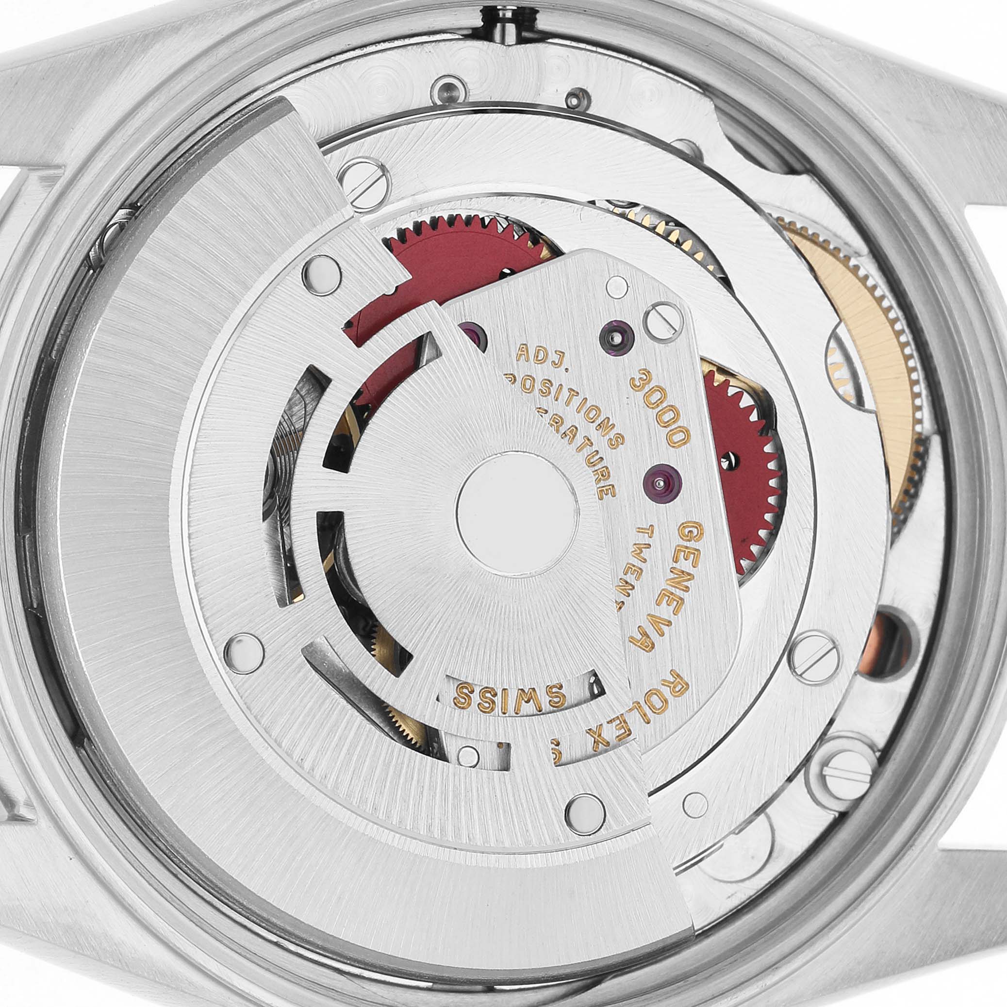The image shows the movement of a Rolex Air-King 14000 Mens Stainless Steel Pink Dial watch from a back view, highlighting gears and inscriptions.