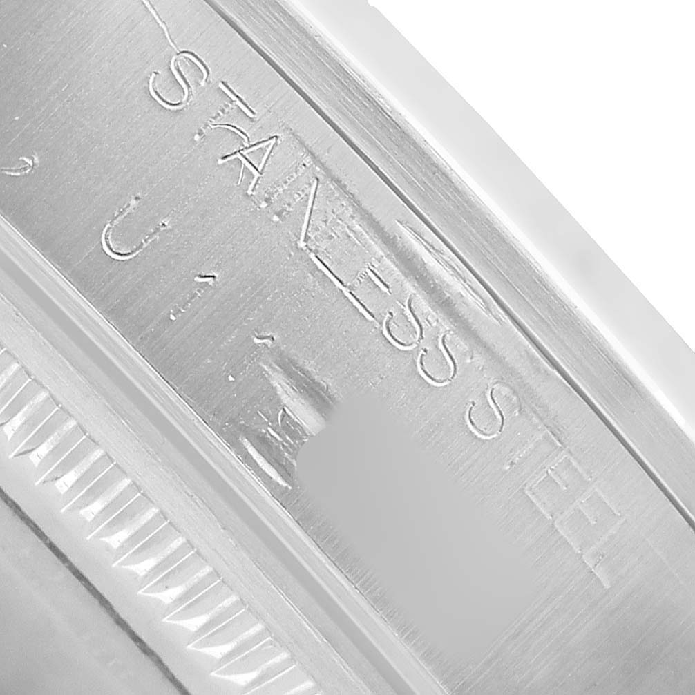 The image shows a close-up of the Rolex Air-King 14000 Mens Stainless Steel Pink Dial watch case edge with "STAINLESS STEEL" engraving.