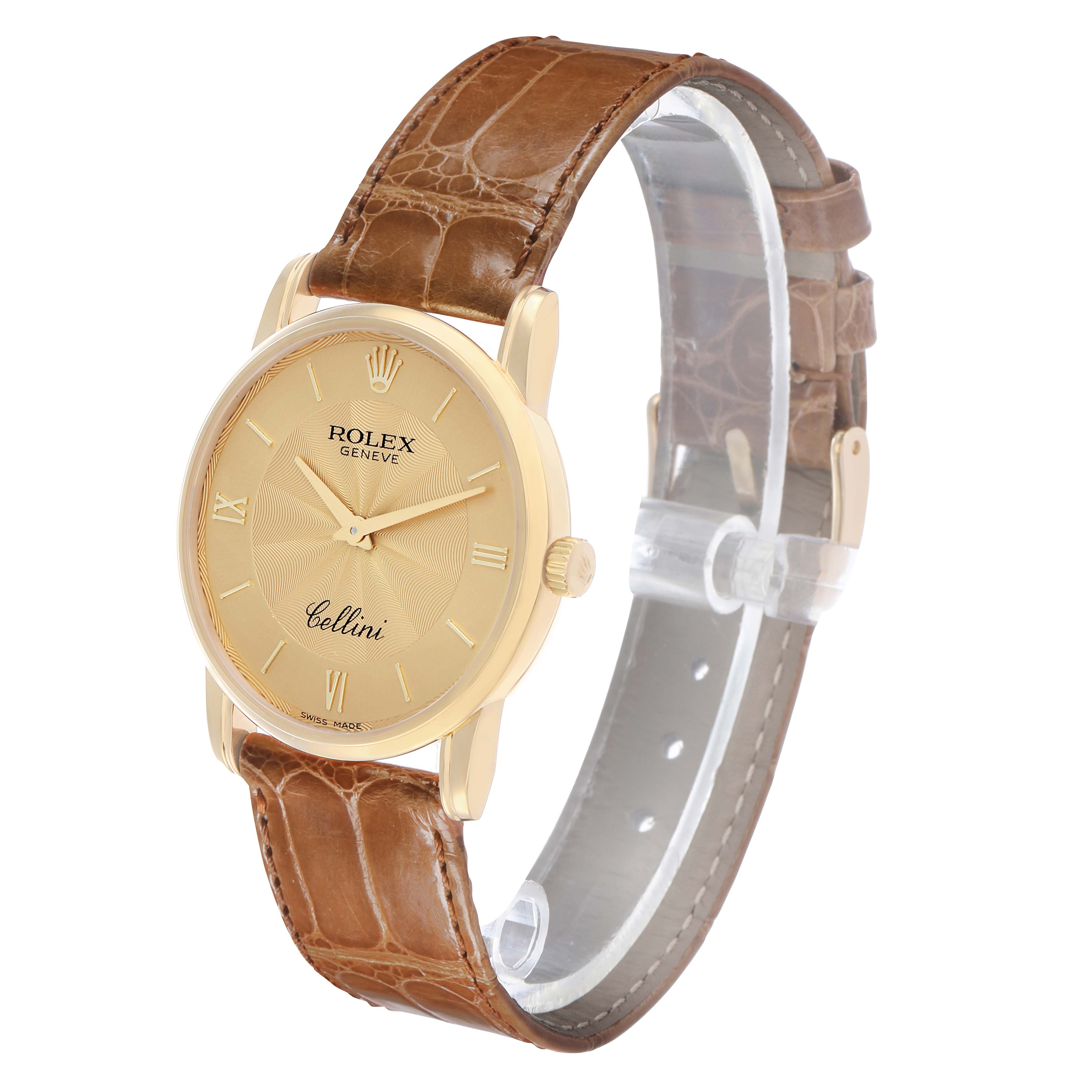 The Rolex Cellini 5116 Men's Yellow Gold Champagne Dial watch is shown from a front-left angle, highlighting the dial, crown, and brown leather strap.