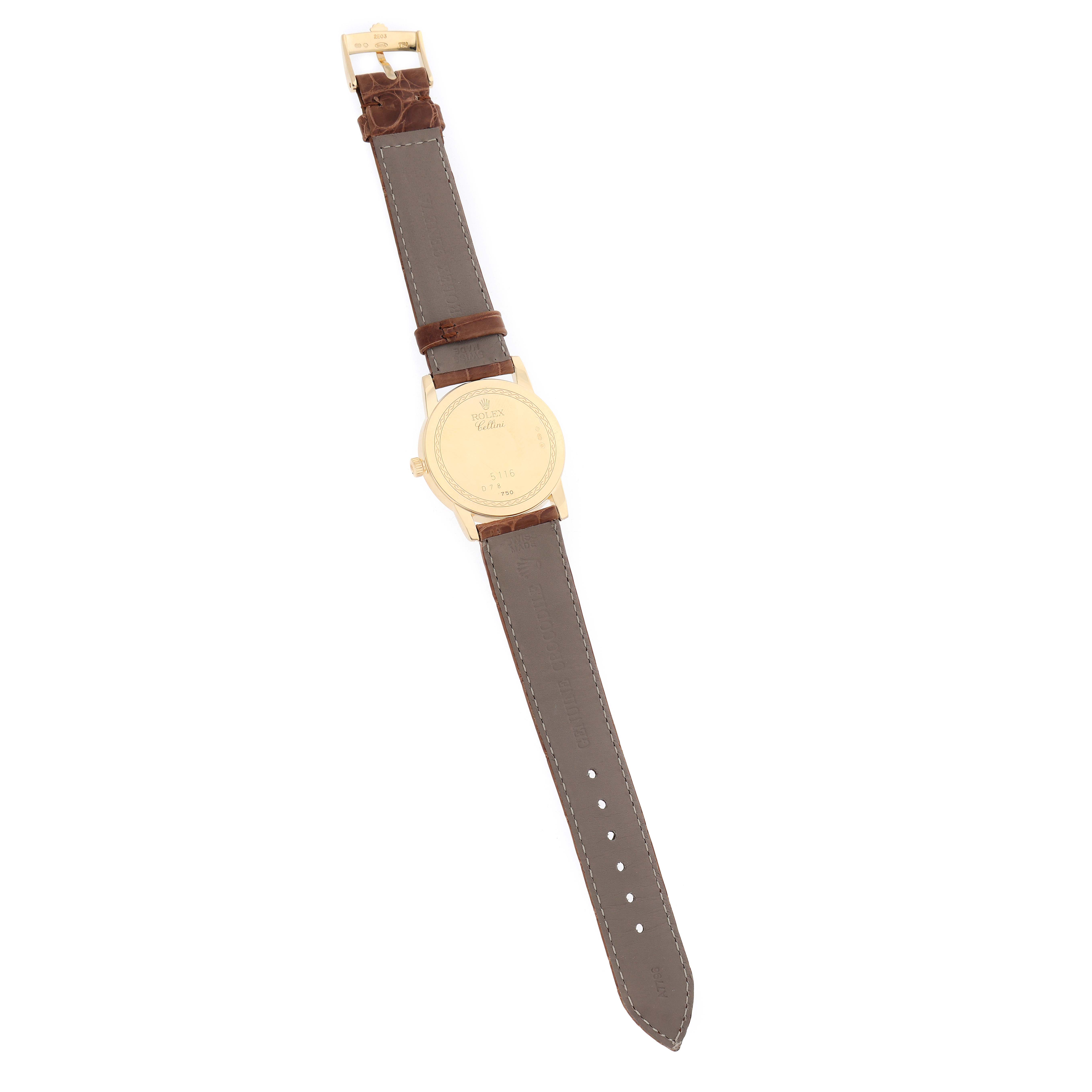 The Rolex Cellini 5116 Men's Yellow Gold Champagne Dial watch is shown from the back, featuring the case back and leather strap with buckle.