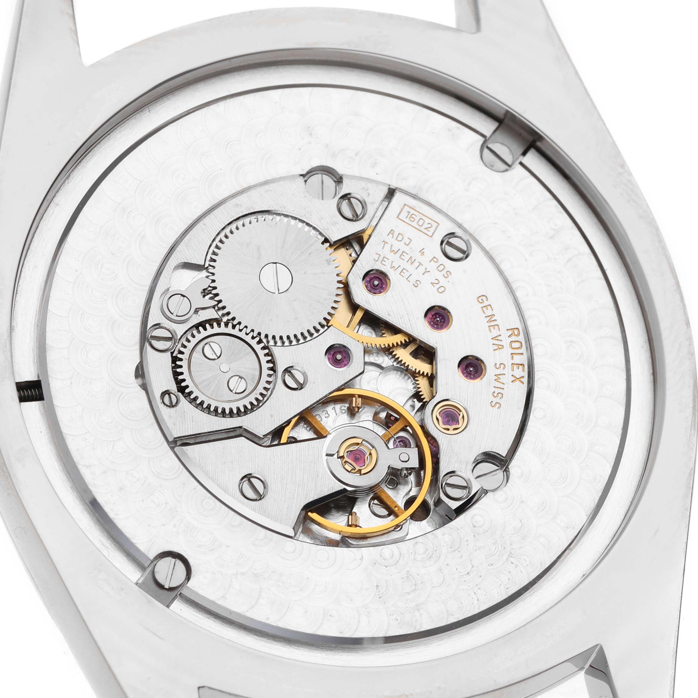 The image shows the back view of a Rolex Cellini 4243 Men's White Gold Black Dial watch, highlighting the inner movement and gears.
