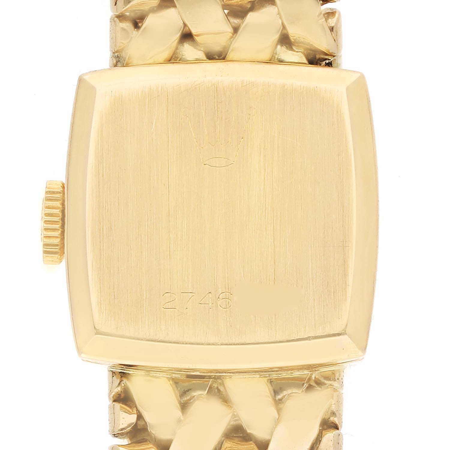 The Rolex Cocktail 8298 Women's Yellow Gold Silver Dial watch is shown from the back, highlighting its case, crown, and part of the metal bracelet.