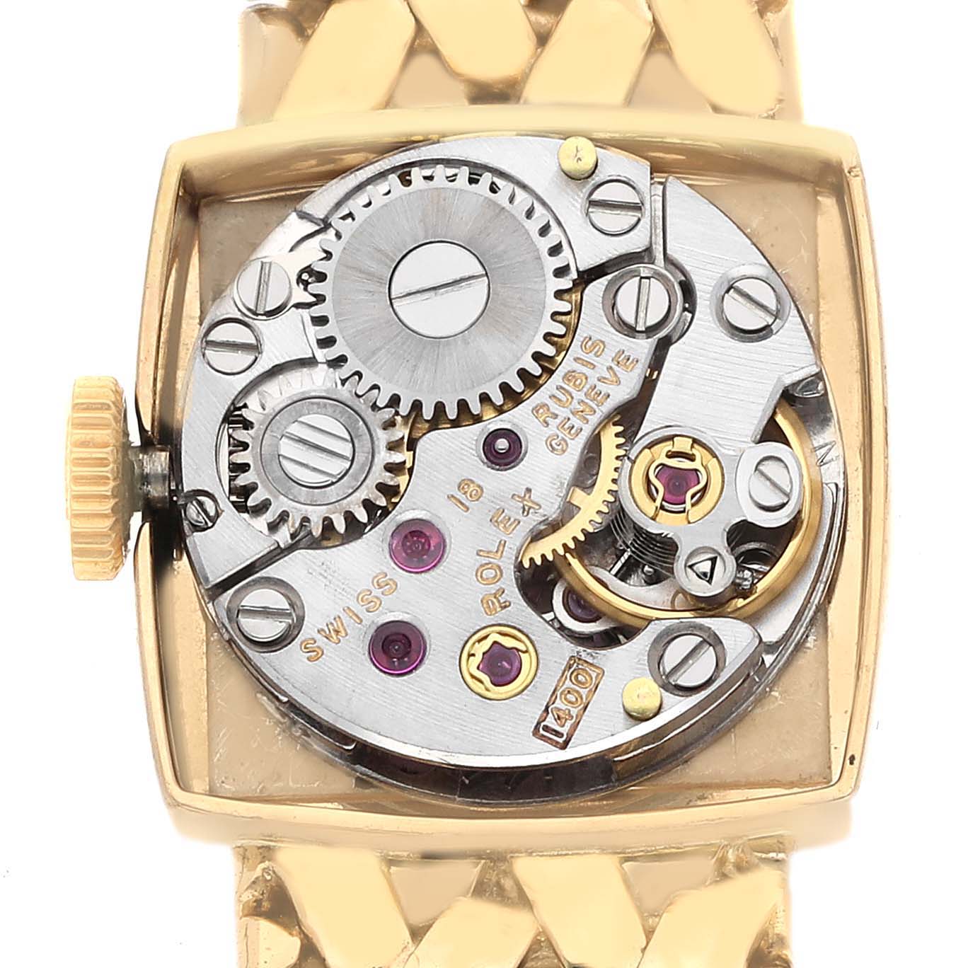 The image shows the back of the Rolex Cocktail 8298 Women's Yellow Gold Silver Dial model watch, revealing its intricate mechanical movement components.