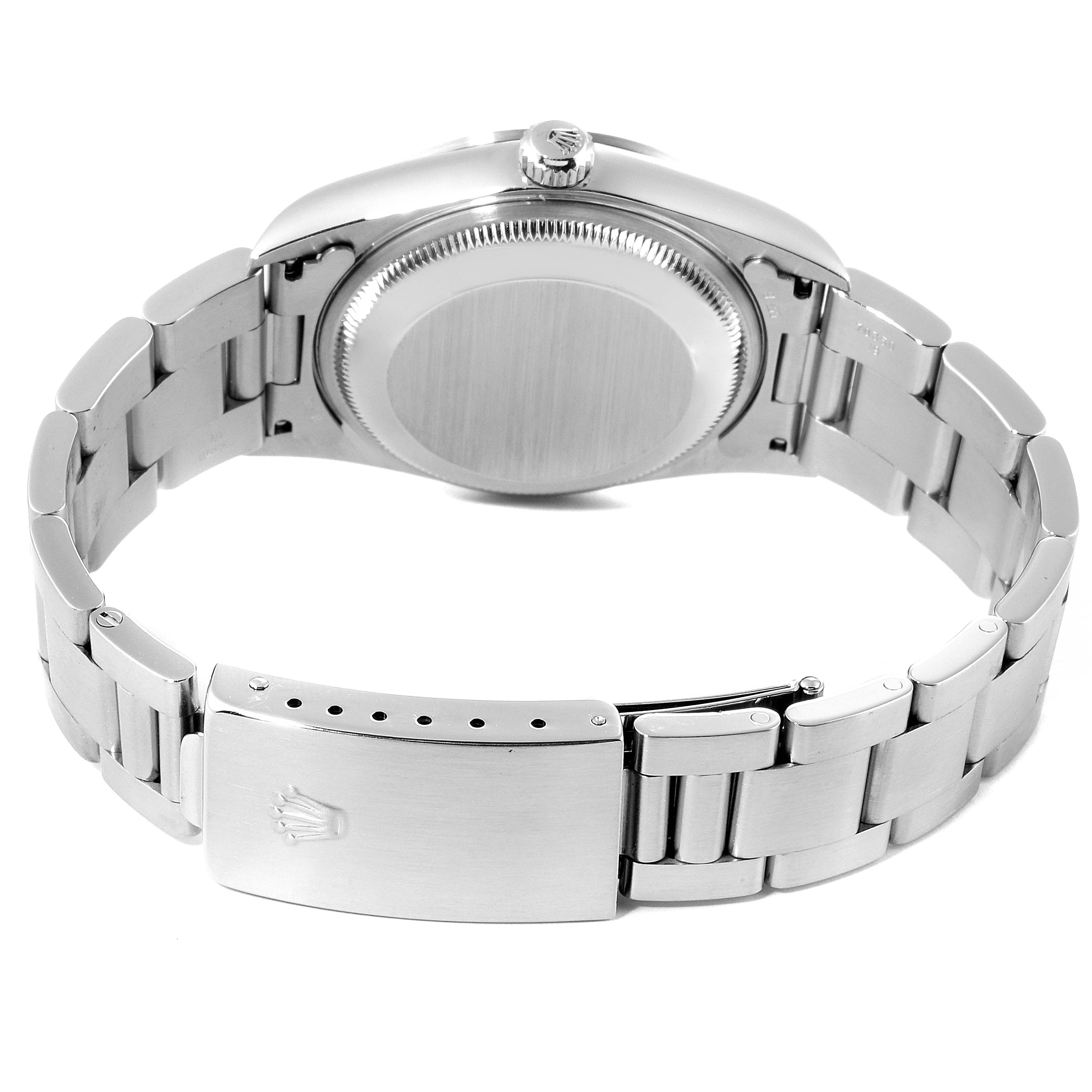 The image shows the back view of a Rolex Date 15200 Men's Stainless Steel Black Dial 15200 Men's Stainless Steel Black Dial model, highlighting the case back and the bracelet with the clasp.