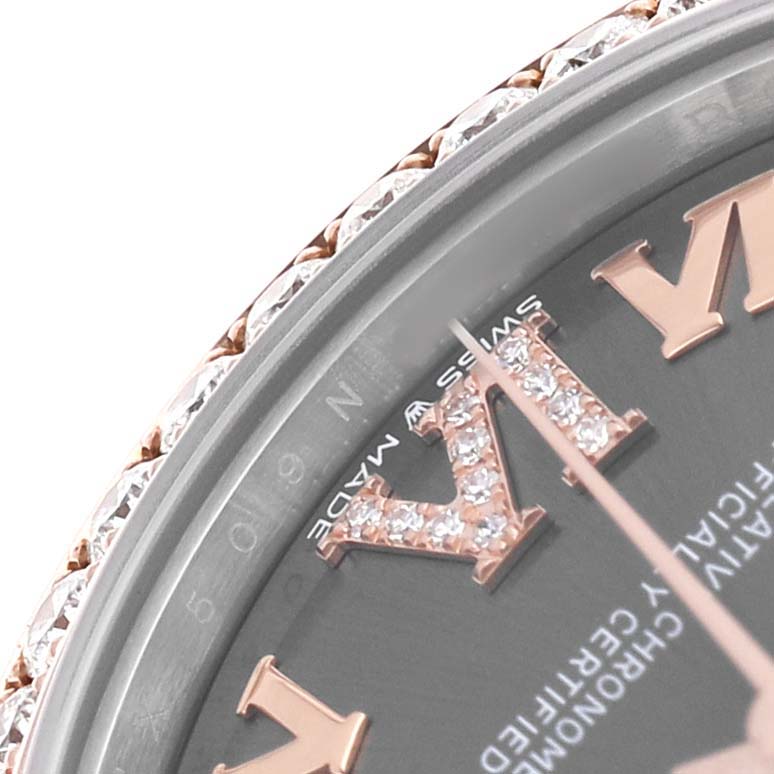 The image shows a close-up of the bezel and face of a Rolex Mid-Size 278381RBR-0020 Womens Stainless Steel Grey Dial watch, highlighting a diamond-encrusted Roman numeral.