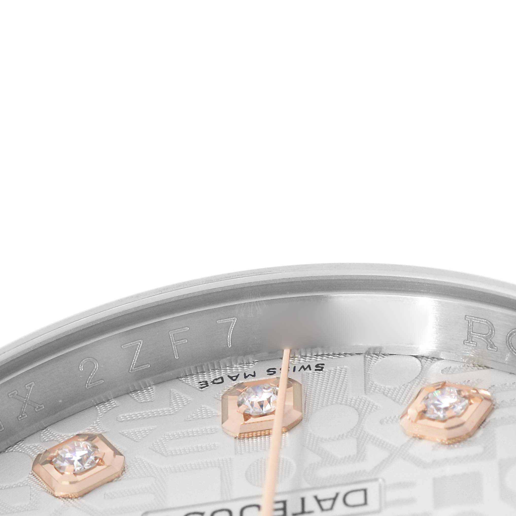 The image shows a close-up of the dial's upper edge and indices of a Rolex Datejust 116231 Men's Steel and Gold (two tone) Silver Dial, highlighting gemstones and part of the inner bezel.