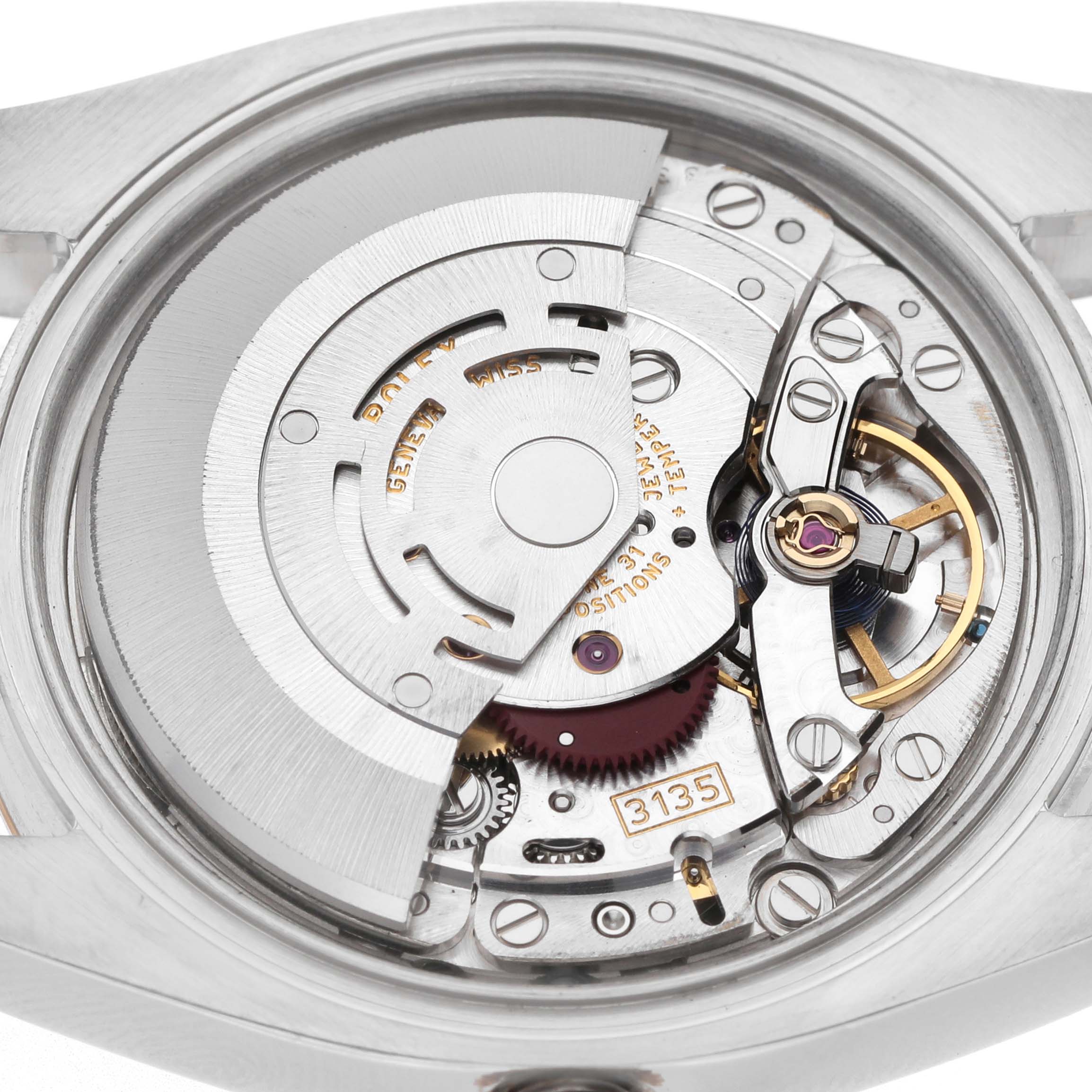 The image shows the movement of a Rolex Datejust 116231 Men's Steel and Gold (two tone) Silver Dial watch from a top-down angle, highlighting its intricate mechanical parts.