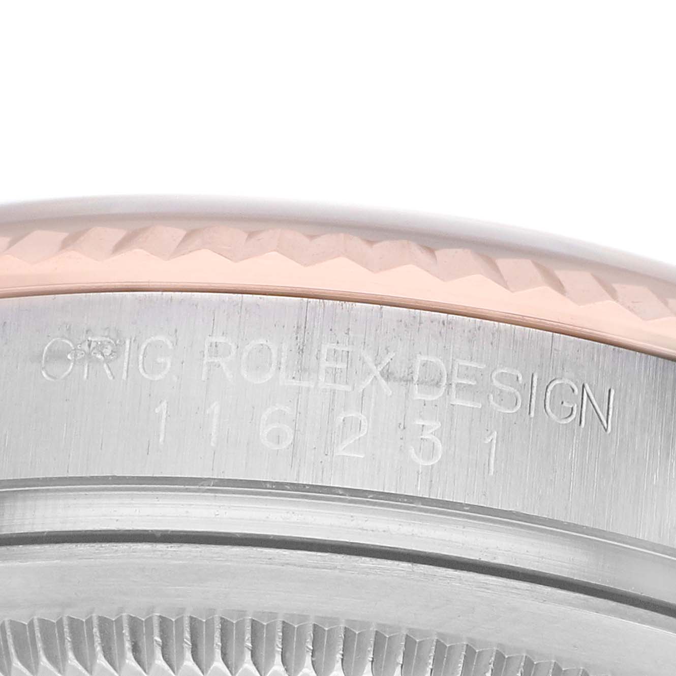 The image shows a close-up of the side of the Rolex Datejust 116231 Men's Steel and Gold (two tone) Silver Dial with its engraved model number and partial view of the bezel.