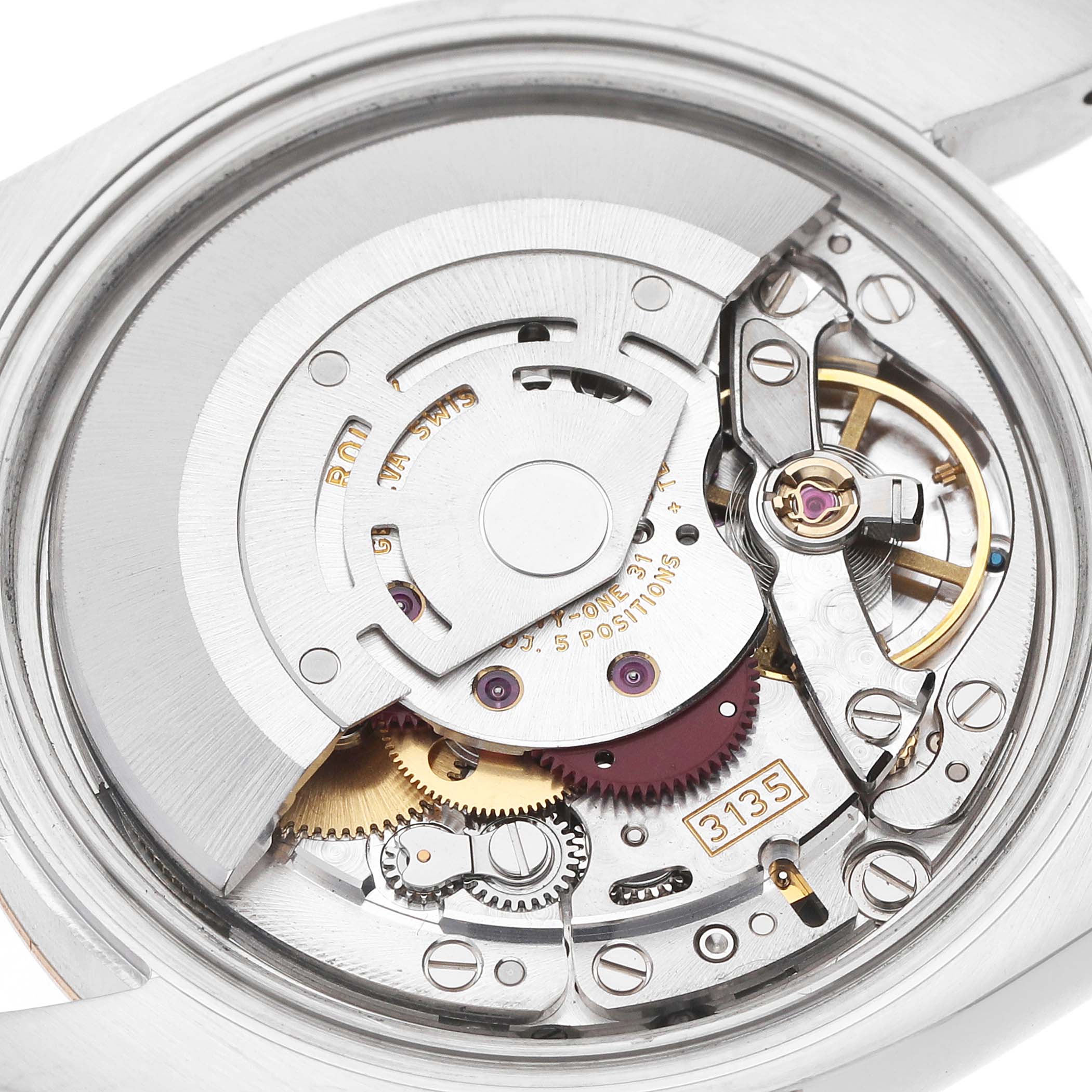 The image shows the movement of a Rolex Datejust 116231 Men's Steel and Gold (two tone) Silver Dial, highlighting the intricate mechanics from a rear angle.
