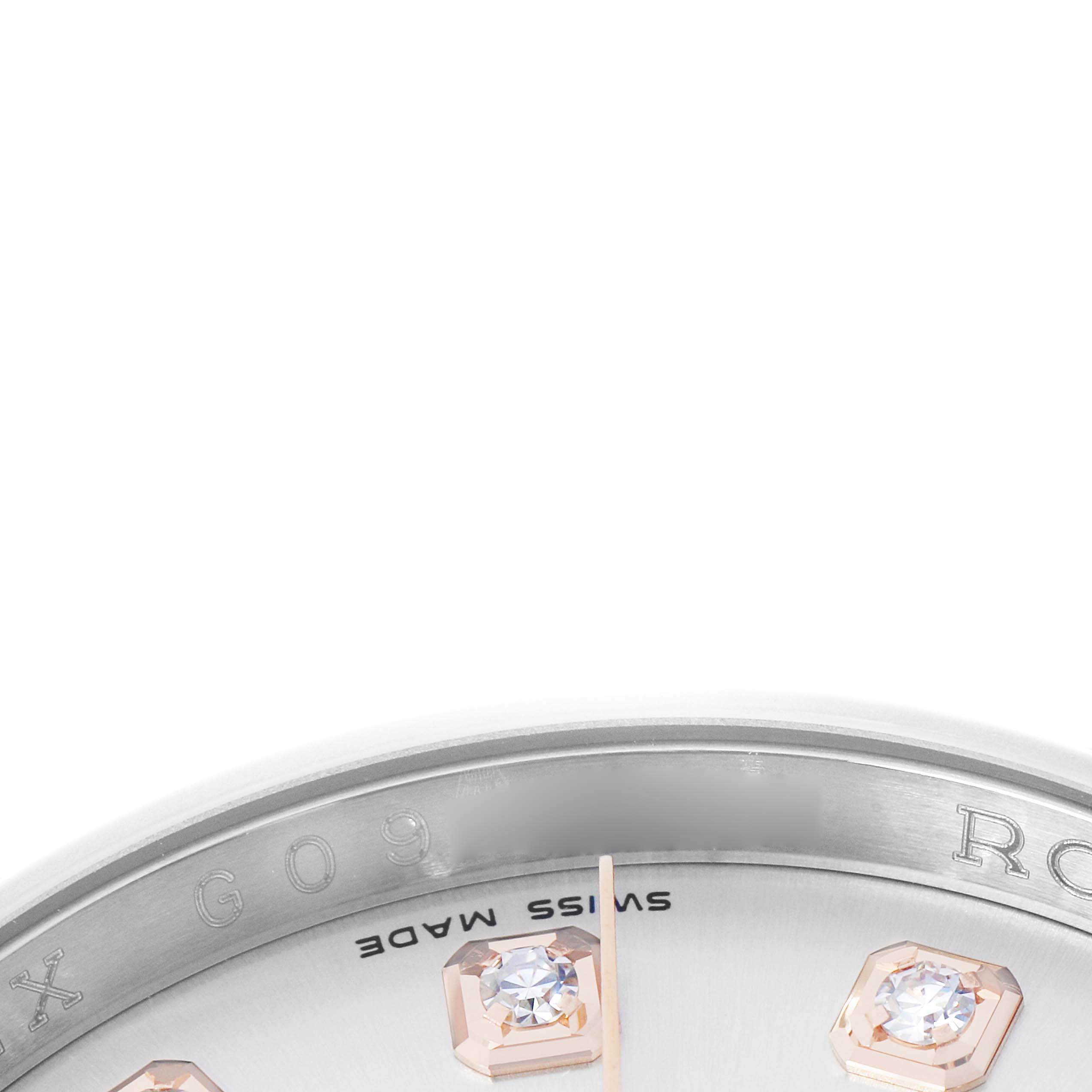 The image shows a close-up of the dial edge and markers of a Rolex Datejust 116231 Men's Steel and Gold (two tone) Silver Dial watch, highlighting the bezel and diamond markers.