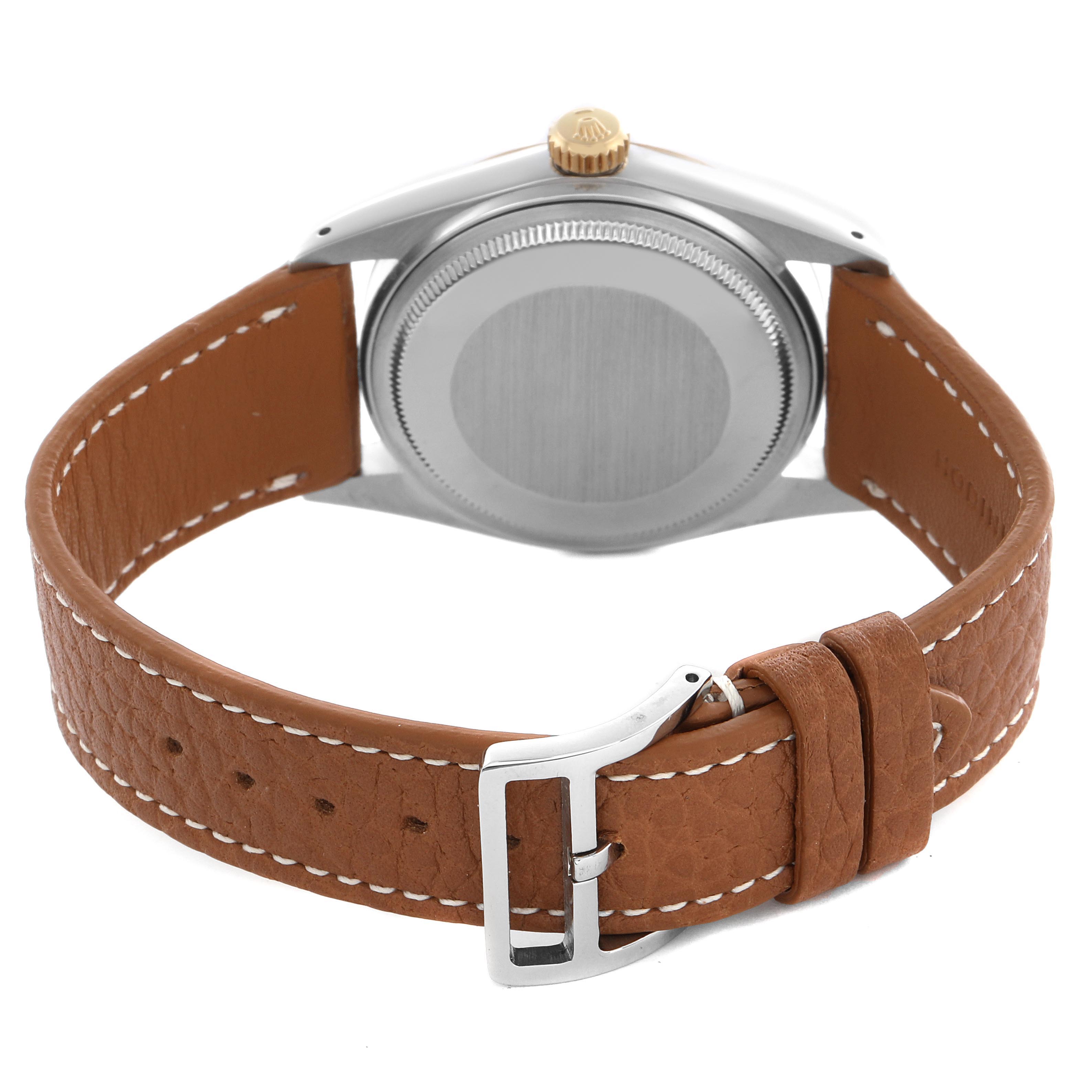 The image shows the back of a Rolex Datejust 16013 Men's Steel and Gold (two tone) Champagne Dial watch, highlighting the case back, crown, and brown leather strap with a buckle.
