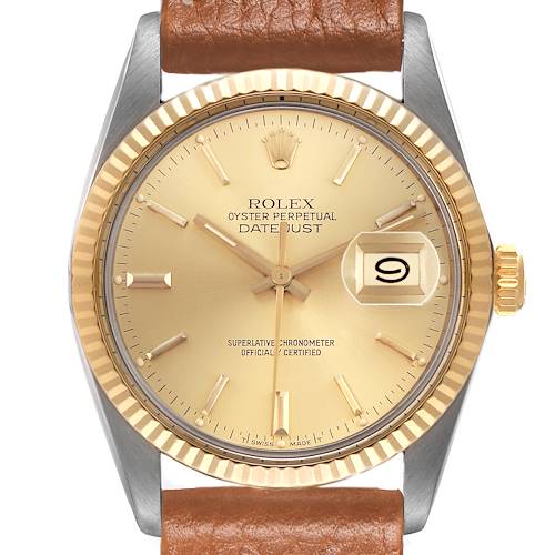 The Rolex Datejust 16013 Men's Steel and Gold (two tone) Champagne Dial watch is shown from the front, highlighting its gold dial, fluted bezel, and brown leather strap.