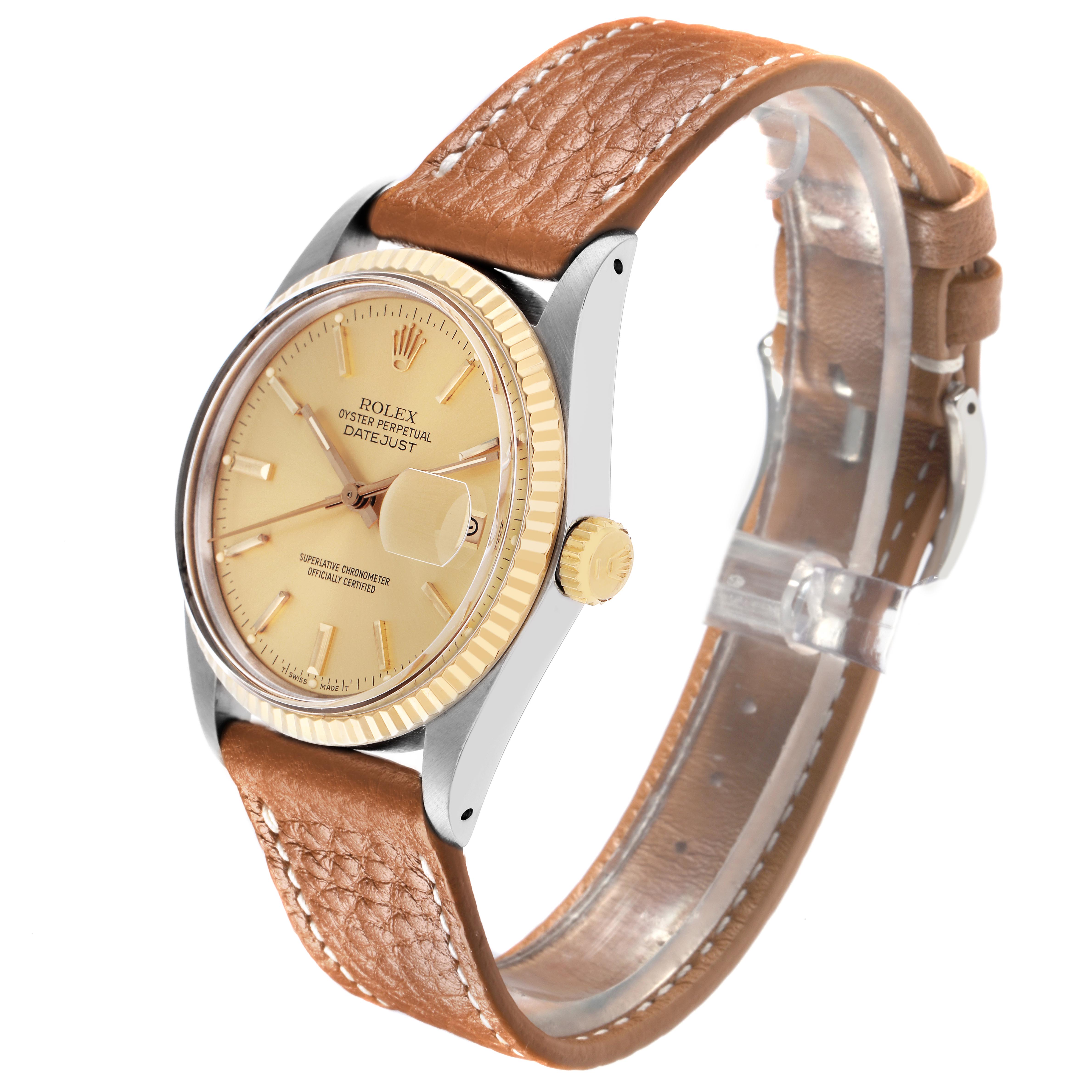 The Rolex Datejust 16013 Men's Steel and Gold (two tone) Champagne Dial watch is shown at a side angle, displaying its face, bezel, crown, and brown leather strap.
