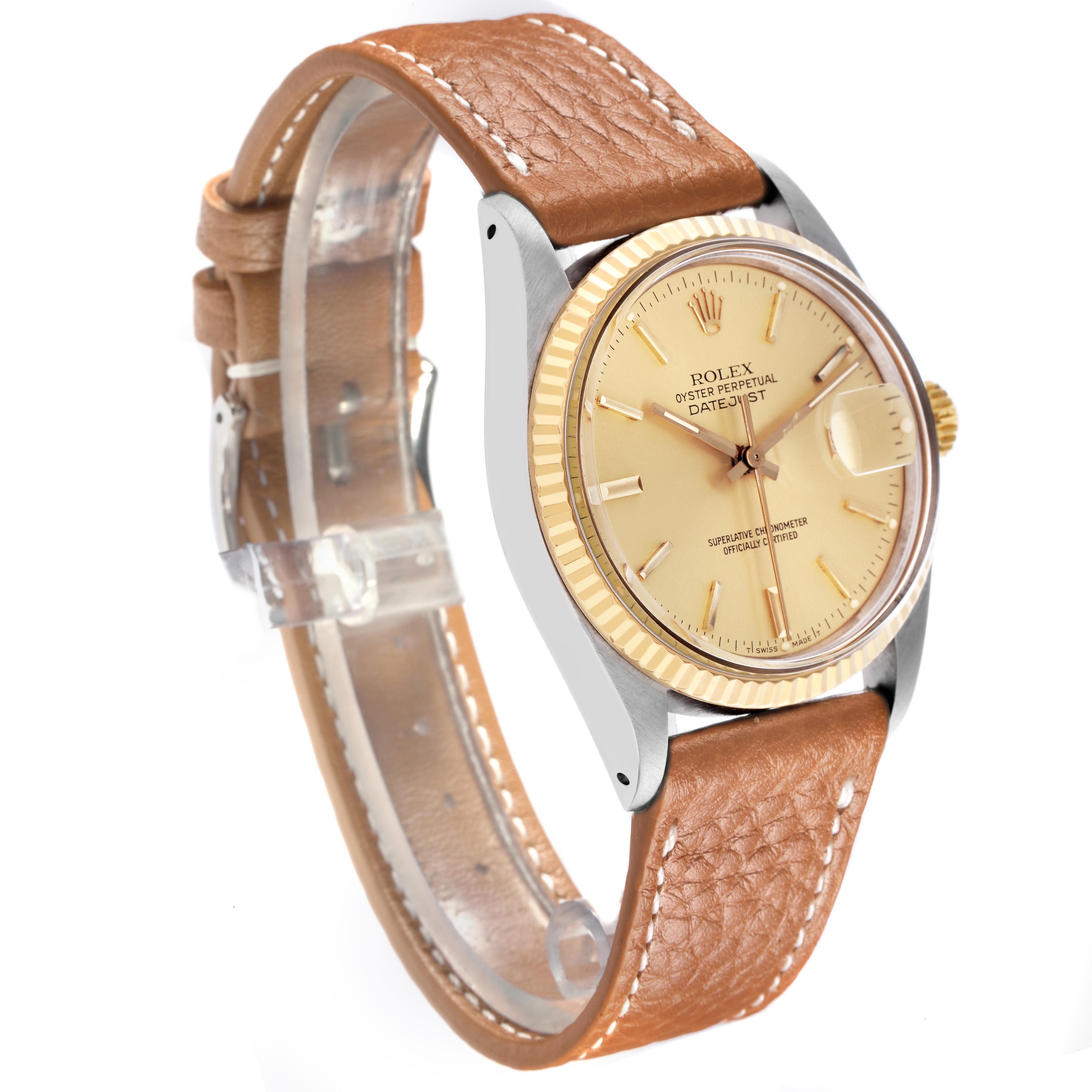 The Rolex Datejust 16013 Men's Steel and Gold (two tone) Champagne Dial watch is shown at a slight angle, featuring the dial, bezel, case, and leather strap.