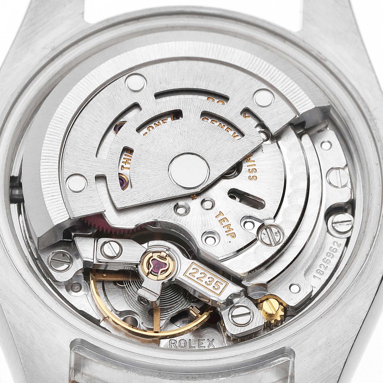 The image shows the movement and inner mechanism of a Rolex Datejust 179173 Women's Steel and Gold (two tone) Silver Dial watch viewed from the back.