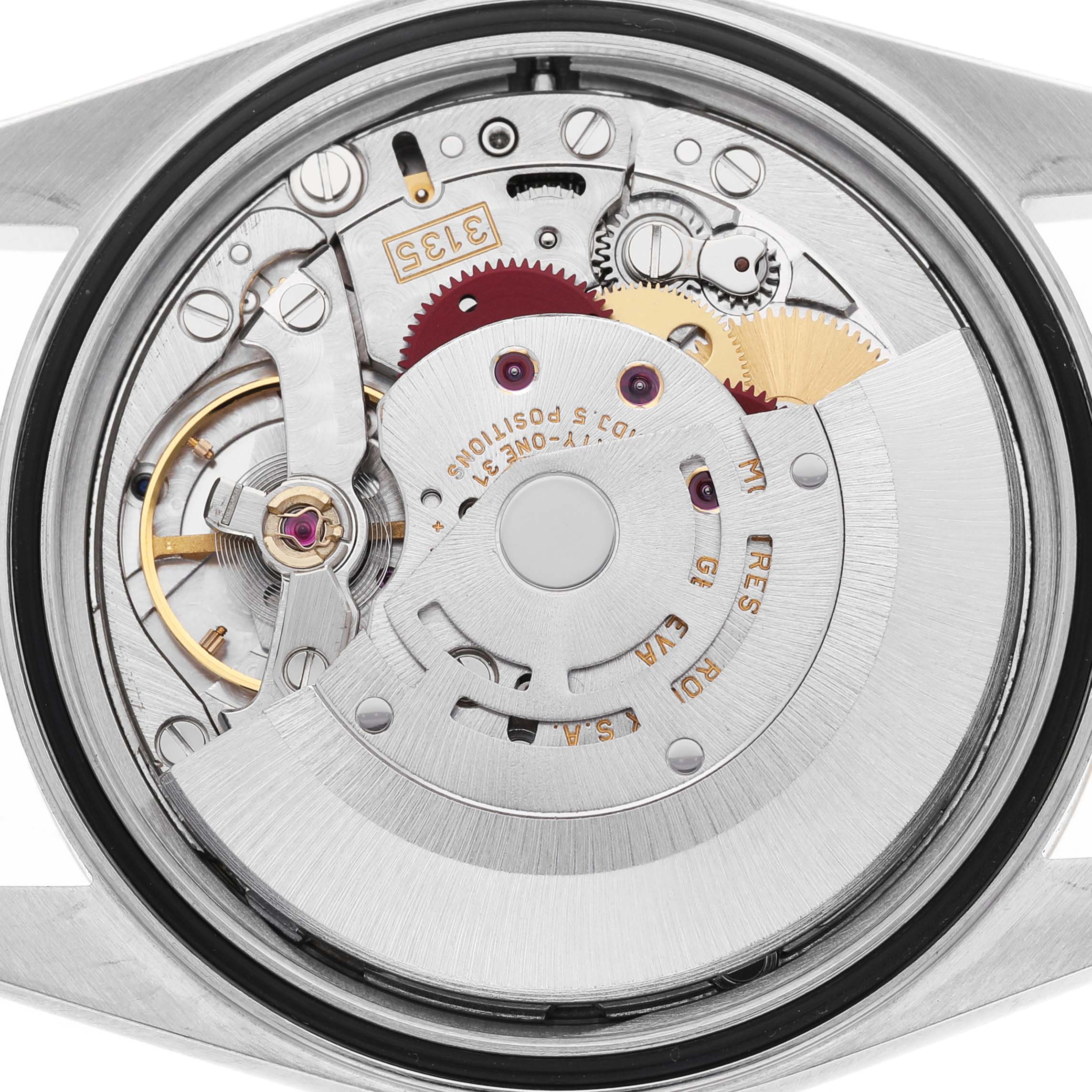 The image shows the intricate movement of a Rolex Datejust 116233 Men's Steel and Gold (two tone) Beige Dial watch, focusing on its internal components and mechanisms.