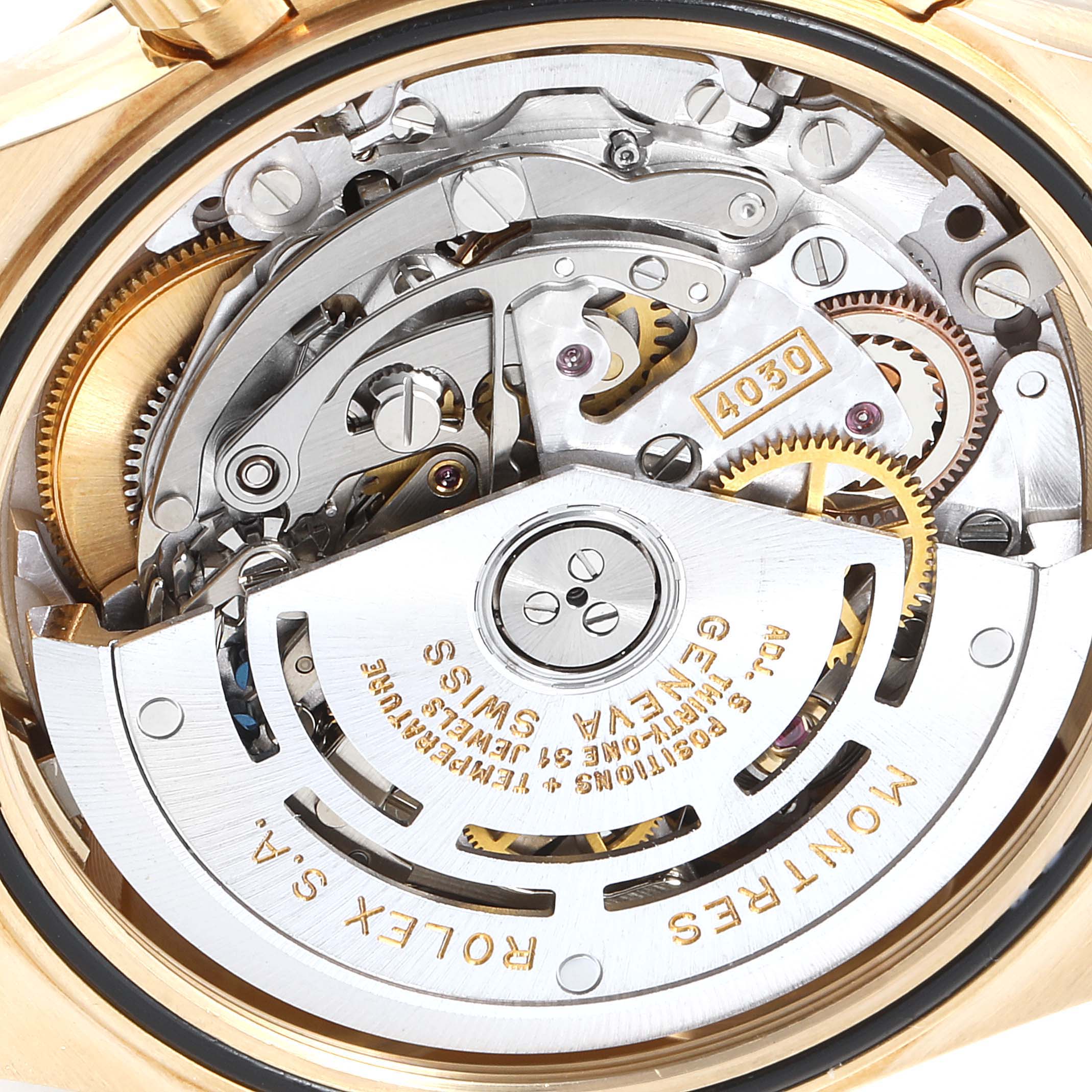 This image shows a close-up of the movement and internal mechanism of a Rolex Daytona 16518 Men's Yellow Gold White Dial 16518 Men's Yellow Gold White Dial watch.