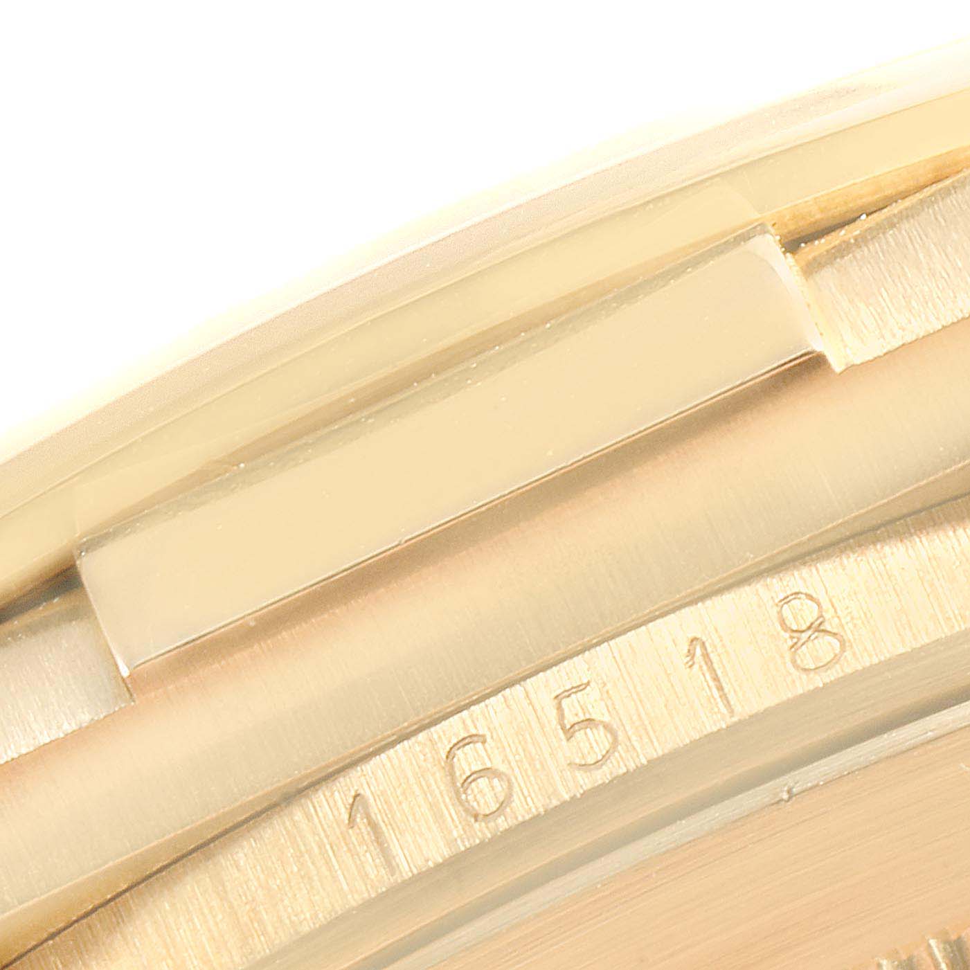 The image shows a close-up angle of the bezel with engraved numbers on a Rolex Daytona 16518 Men's Yellow Gold White Dial 16518 Men's Yellow Gold White Dial watch.