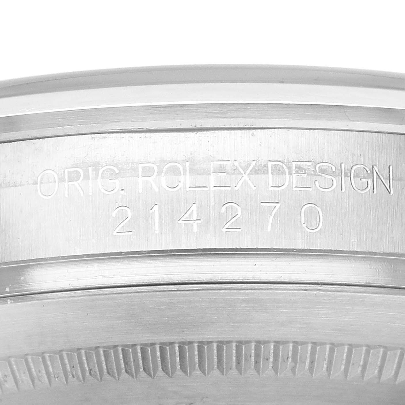 The image shows a close-up of the engraved case-back edge of a Rolex Explorer 214270 Men's Stainless Steel Black Dial model, displaying the model number 214270.