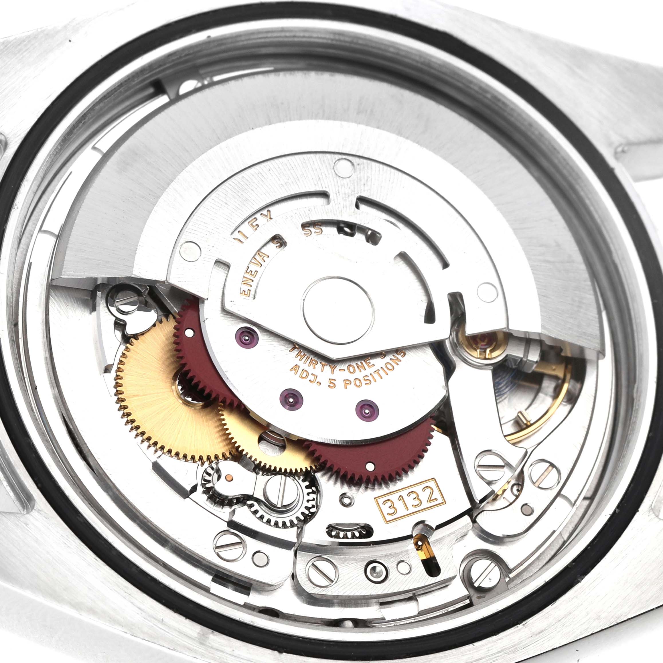 The image shows the inner movement of a Rolex Explorer 214270 Men's Stainless Steel Black Dial watch, highlighting the gears and rotor from a top-down view.