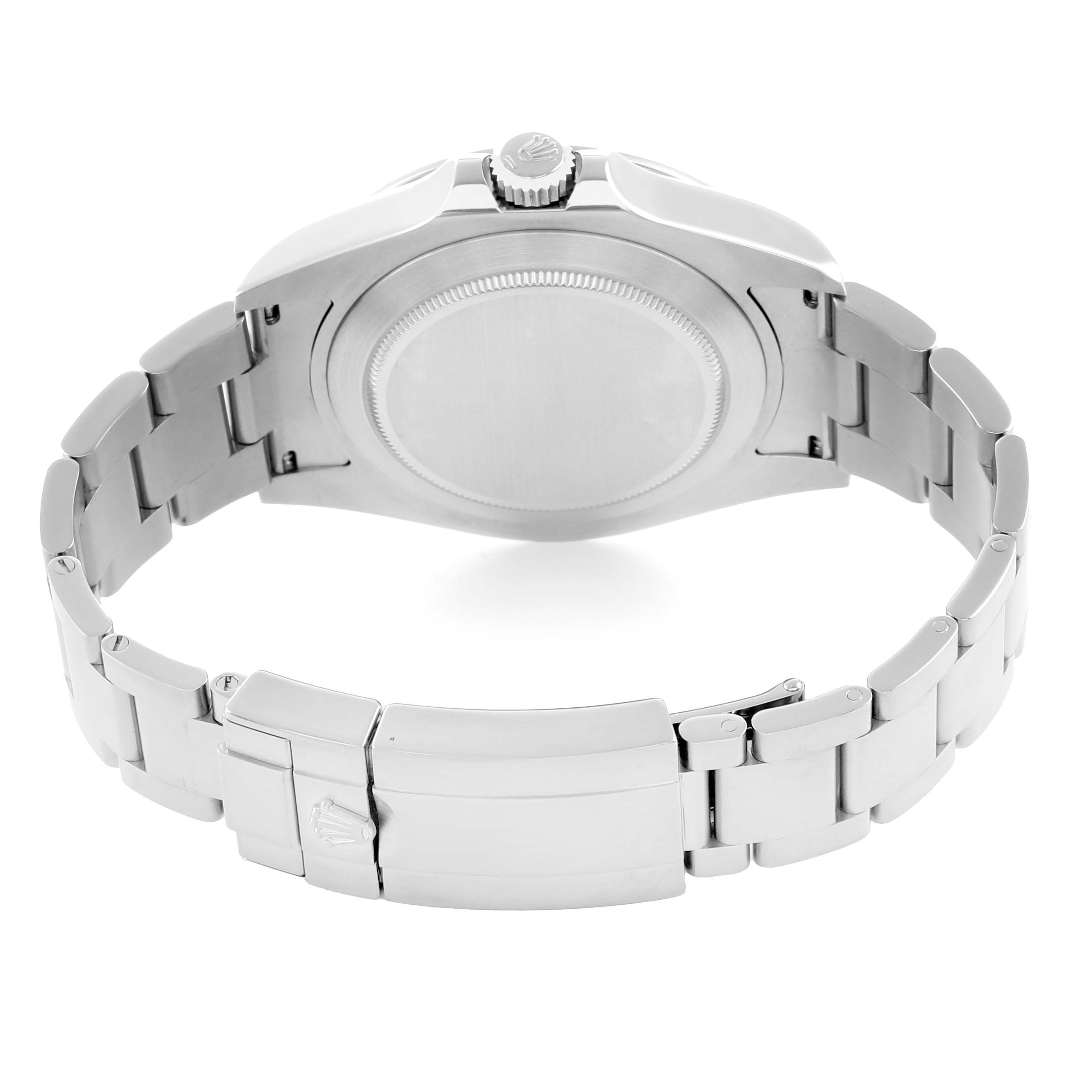 The image shows the back of a Rolex Explorer 216570 Men's Stainless Steel Black Dial watch, highlighting the case back, clasp, and bracelet.