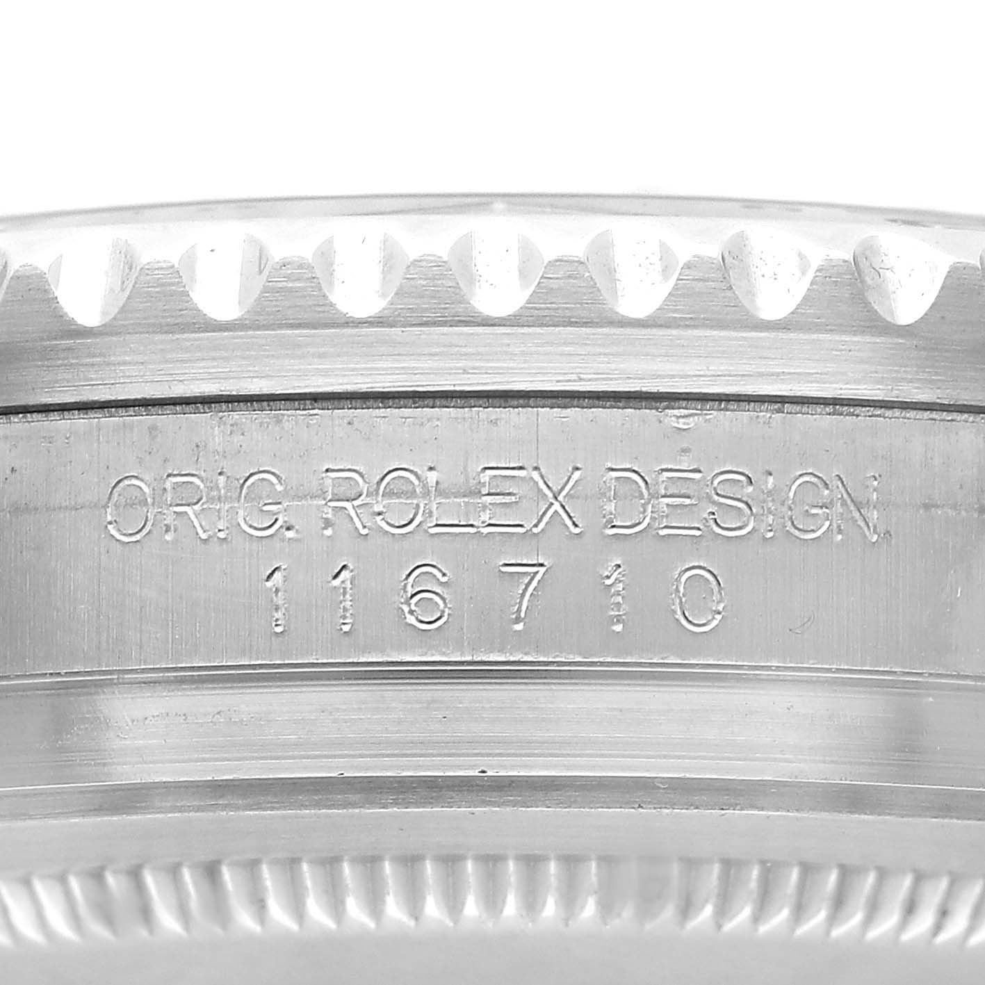 This image shows the engraved side detail of a Rolex GMT-Master 116710 Men's Stainless Steel Black Dial watch bezel, displaying the model number 116710.