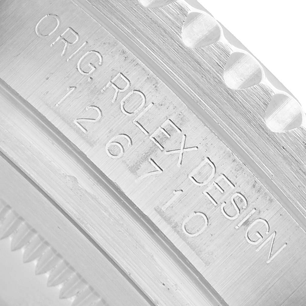 The image shows an engraved side view of the Rolex GMT-Master 126710BLRO Men's Stainless Steel Black Dial model's bezel with design and model details.