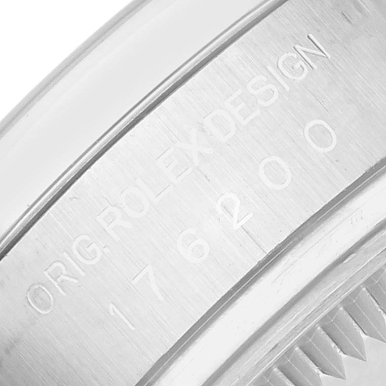 The image shows a close-up of the engraved edge detailing on the back of a Rolex Oyster Perpetual 176200 Women's Stainless Steel Pink Dial watch.