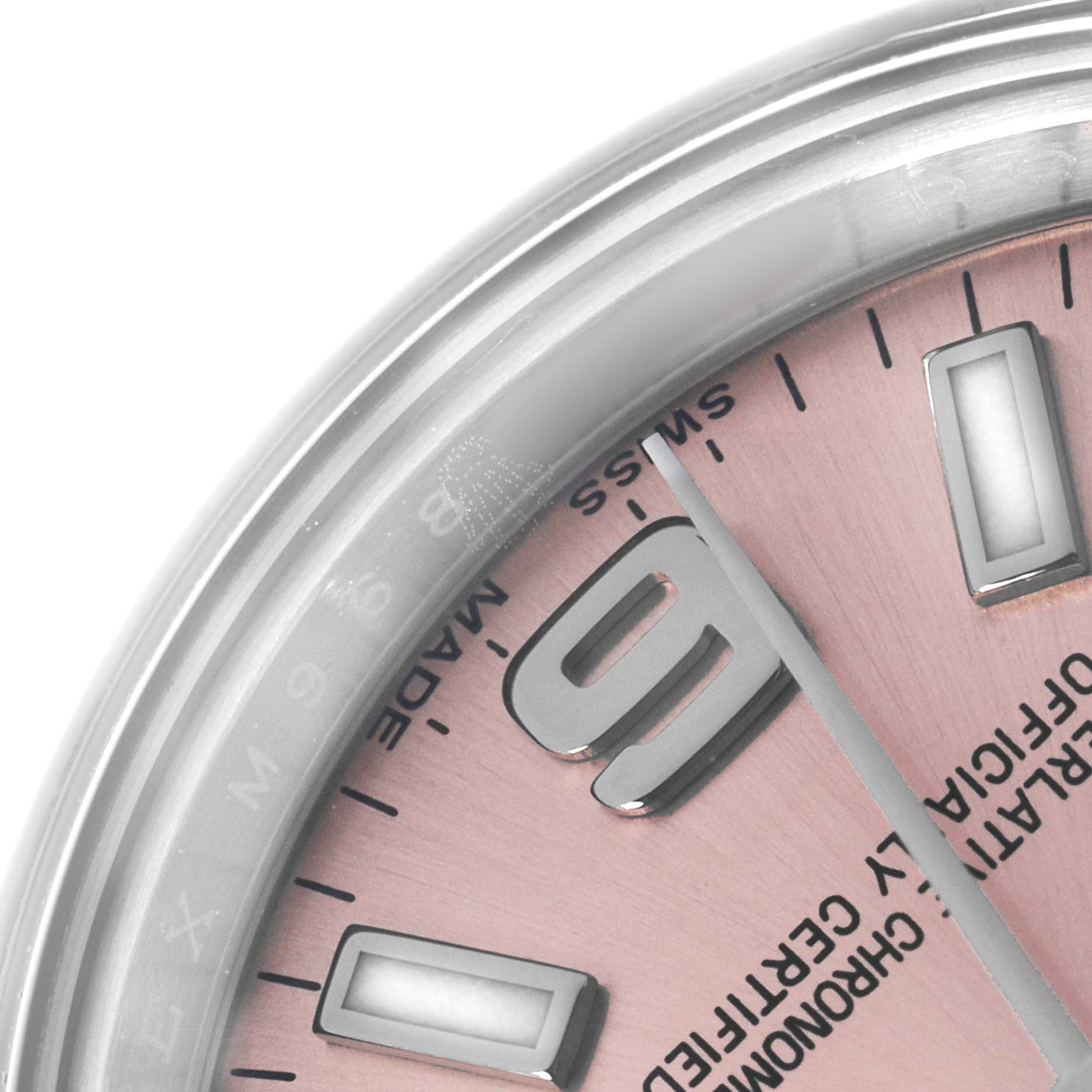 The image shows a close-up of the dial edge of a Rolex Oyster Perpetual 176200 Women's Stainless Steel Pink Dial with visible hour markers and part of the pink face.