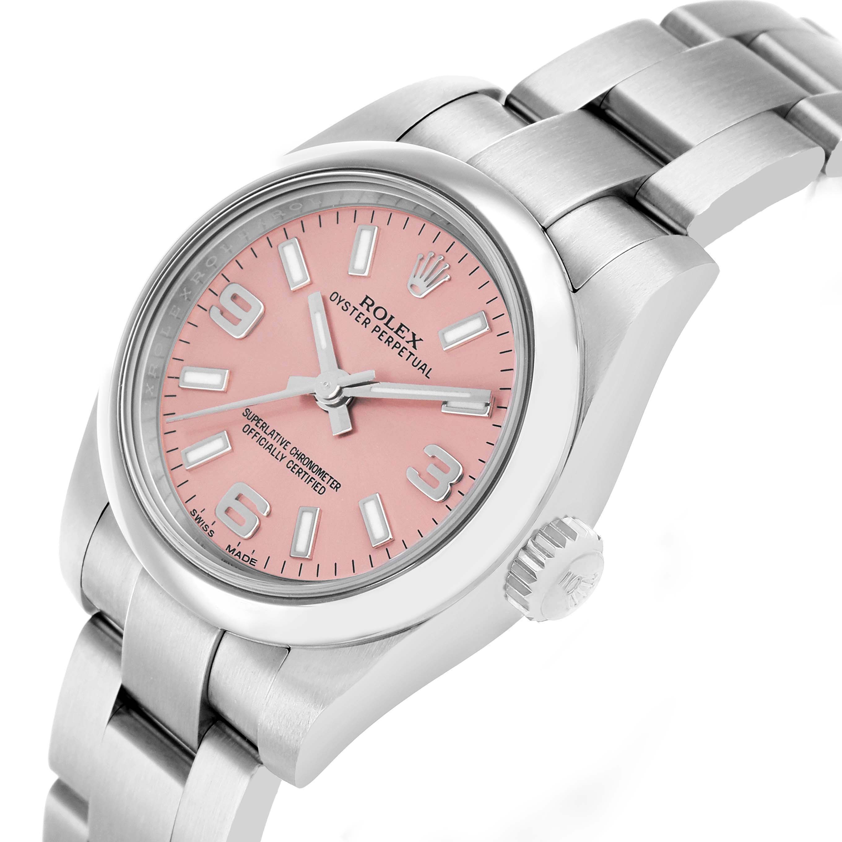 The Rolex Oyster Perpetual 176200 Women's Stainless Steel Pink Dial watch is shown from an angled top view, displaying the pink dial, hands, bezel, and bracelet.