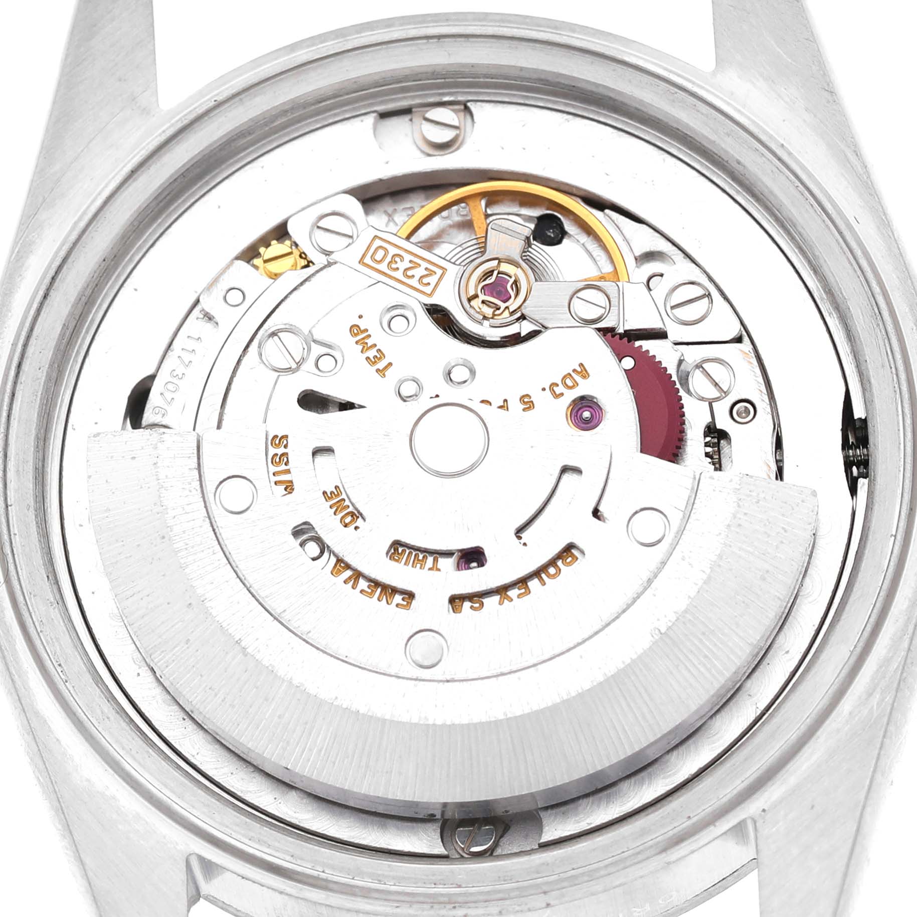 The image shows the movement mechanism of a Rolex Oyster Perpetual 77080 Women's Stainless Steel Black Dial watch from a rear angle.
