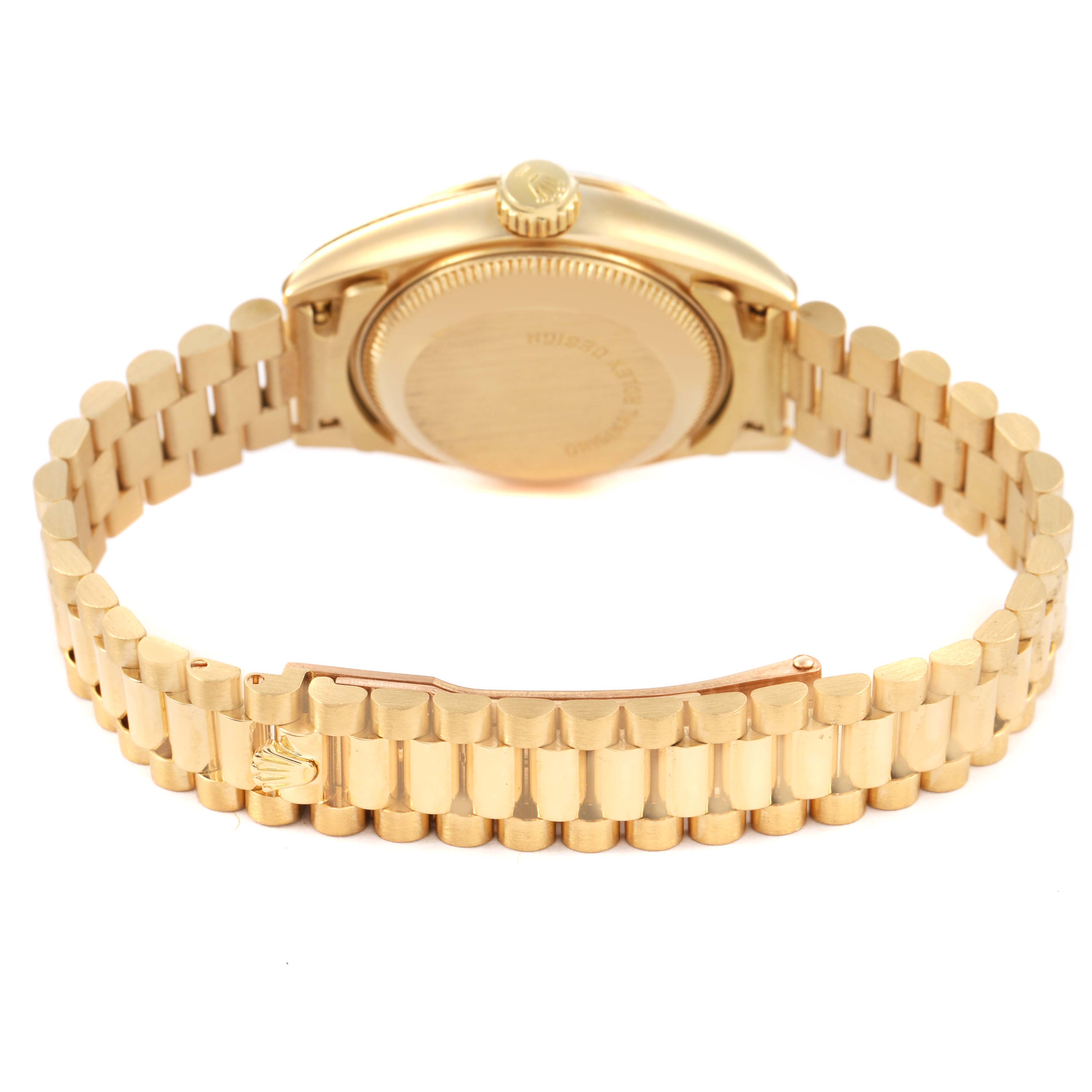 The Rolex President 69178 Women's Yellow Gold Champagne Dial watch is shown from the back, displaying the gold bracelet, clasp, and case back.