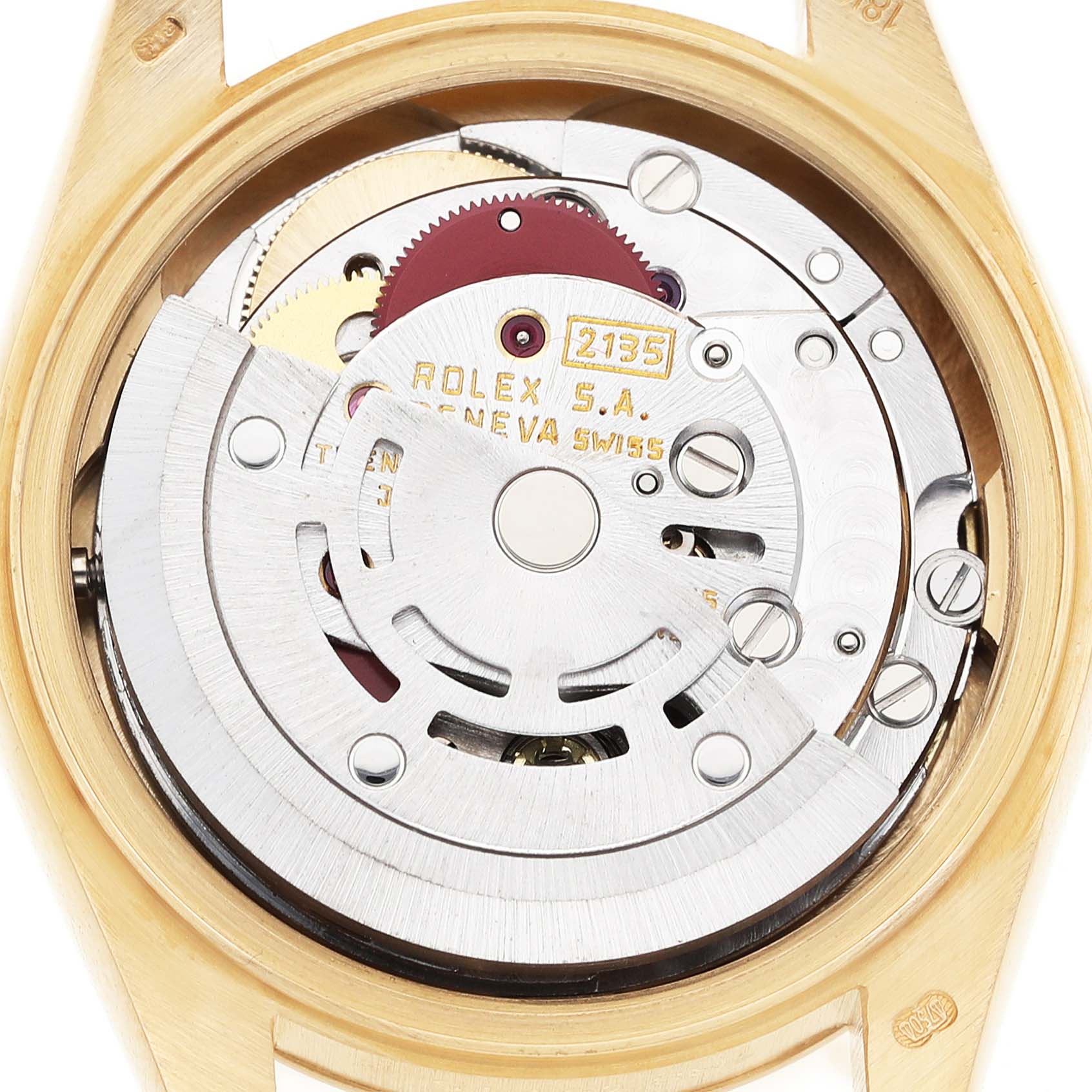 The image shows the movement of a Rolex President 69178 Women's Yellow Gold Champagne Dial model from the back, highlighting the intricate mechanical components.