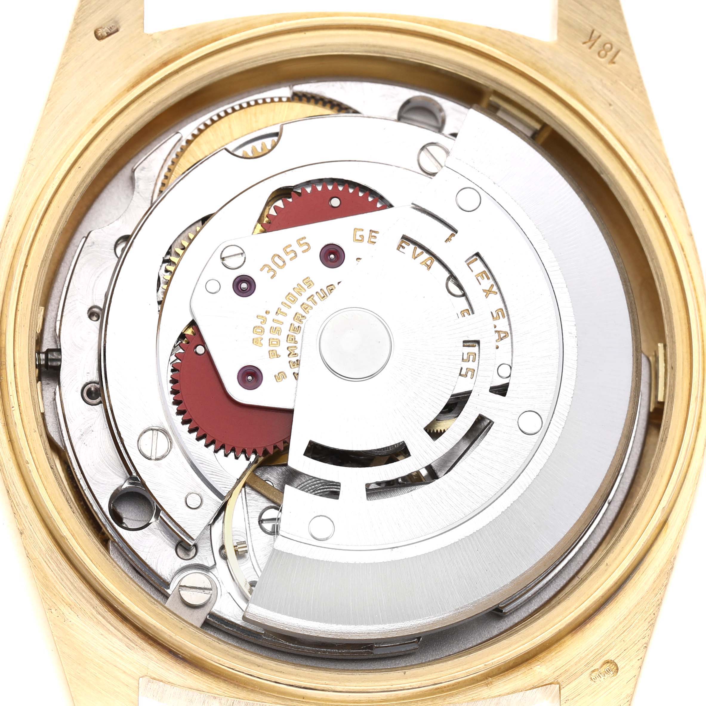 The image shows the movement of a Rolex President 18038 Men's Yellow Gold Champagne Dial model from the back, revealing its intricate mechanical components.