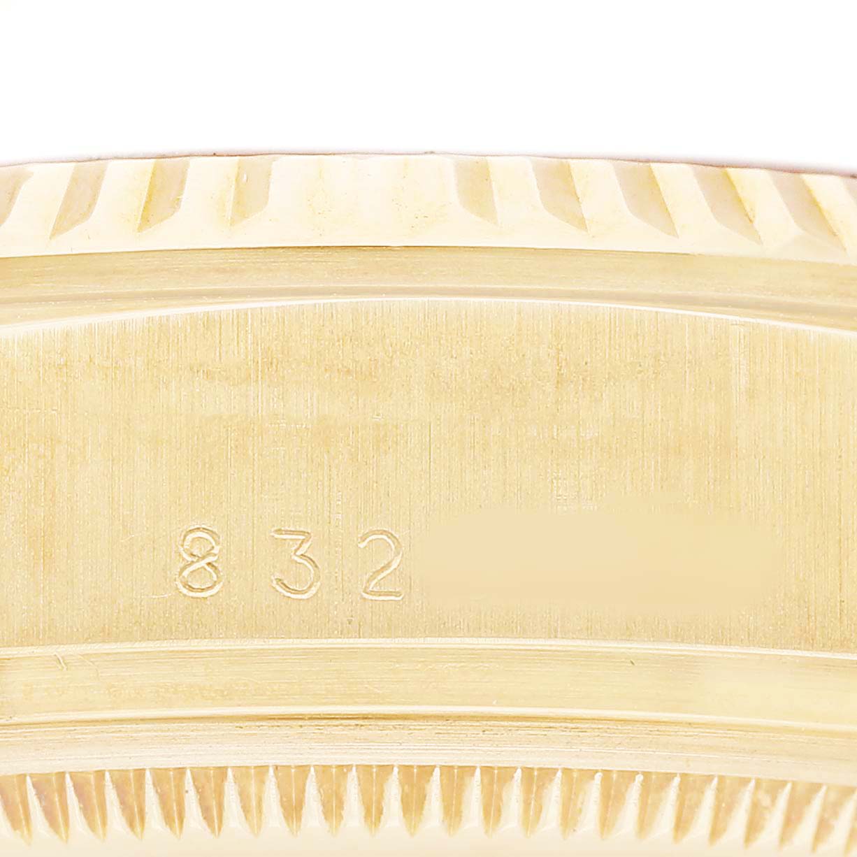 The image shows a close-up of the side of a Rolex President 18038 Men's Yellow Gold Champagne Dial model with visible fluted bezel details and engraved numbers.
