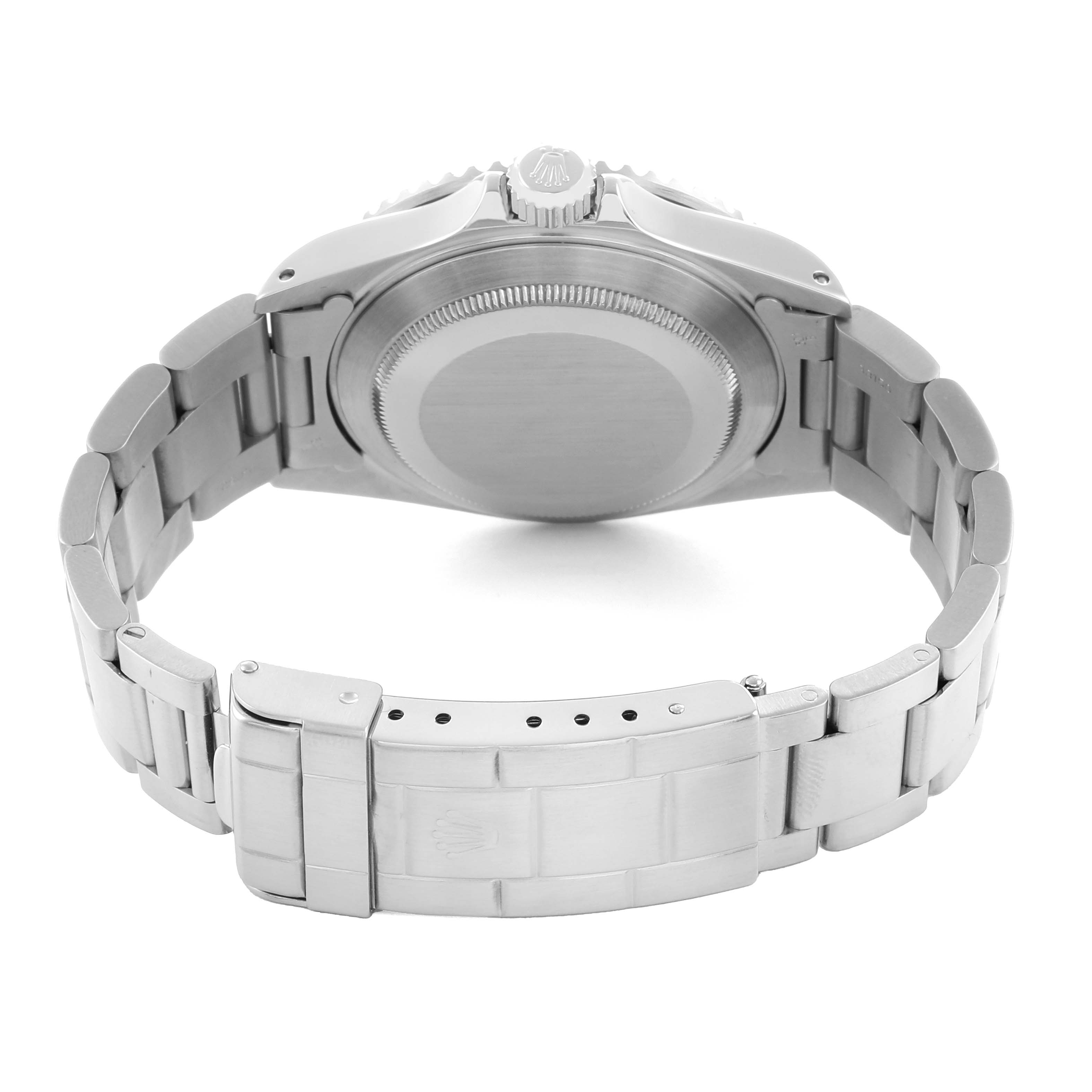 The image shows the back of a Rolex Submariner 16610 Men's Stainless Steel Black Dial watch, including the stainless steel case back and bracelet with clasp.