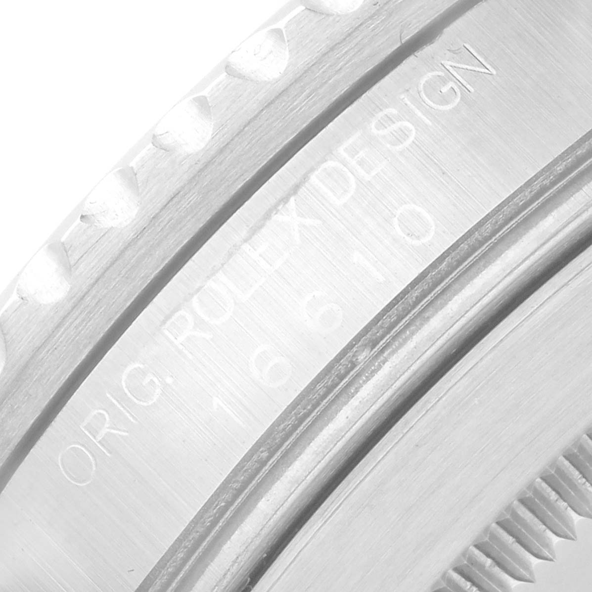 This close-up image shows the case back with the engraved text on the Rolex Submariner 16610 Men's Stainless Steel Black Dial.