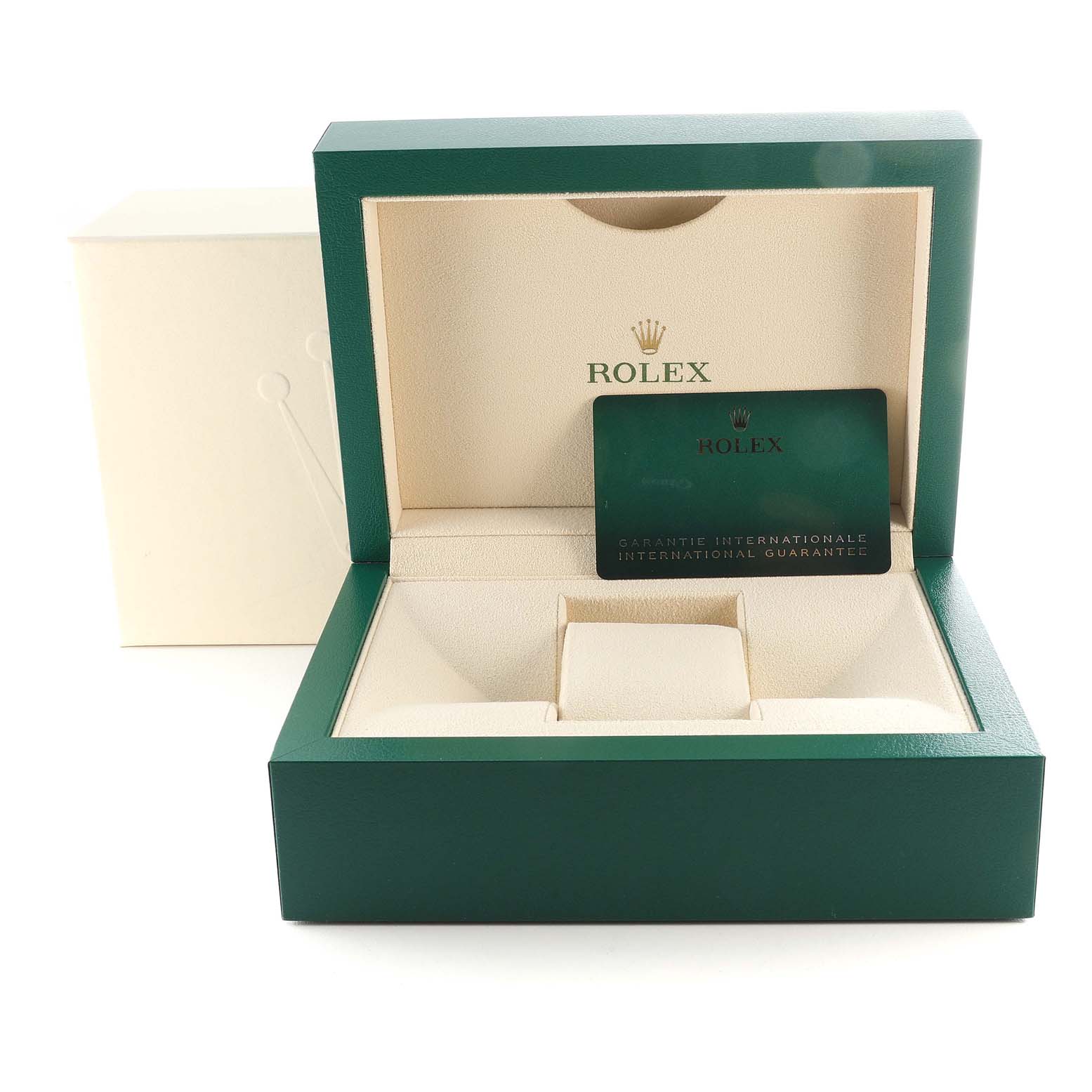 The image shows an open green and cream Rolex box for a Submariner model watch, displaying an international guarantee card.