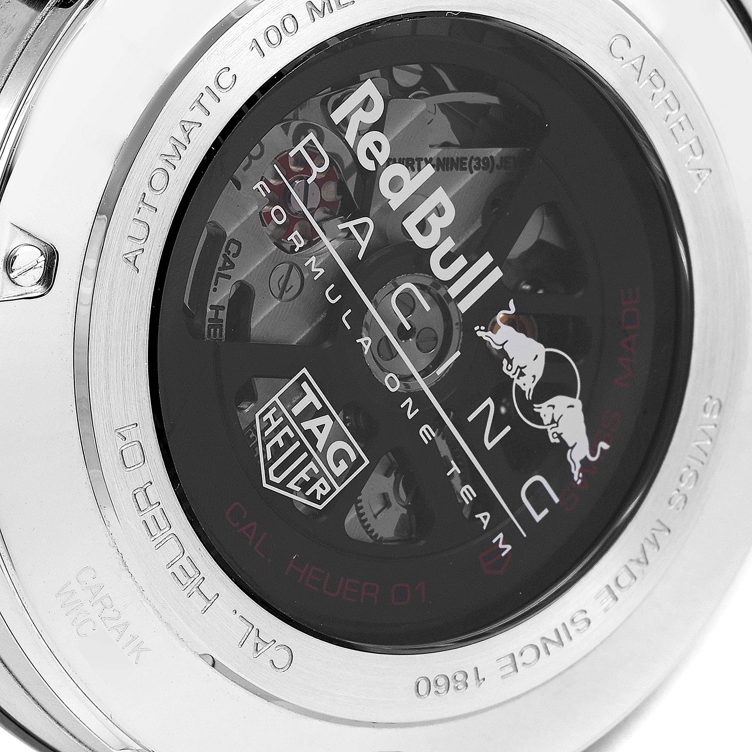 The image shows the back case of a Tag Heuer Carrera CAR2A1K.BA0703 Men
s Stainless Steel Blue Dial CAR2A1K.BA0703 Men
s Stainless Steel Blue Dial watch, displaying "Red Bull Racing" text and visible internal mechanics.